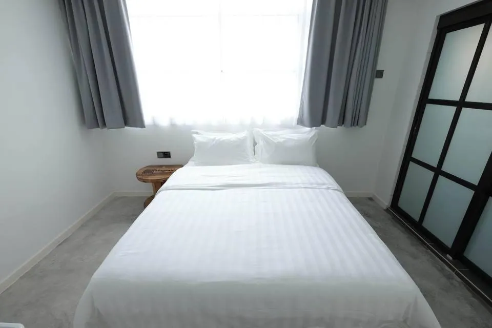 Bed in White Loft Hotel