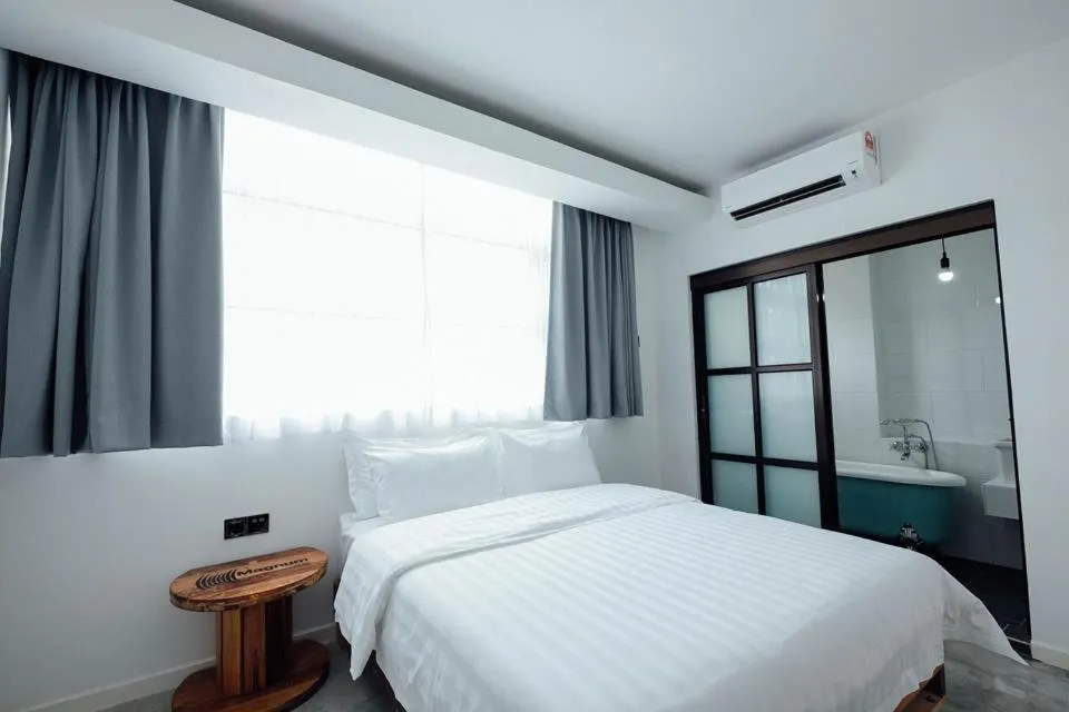 Bed in White Loft Hotel