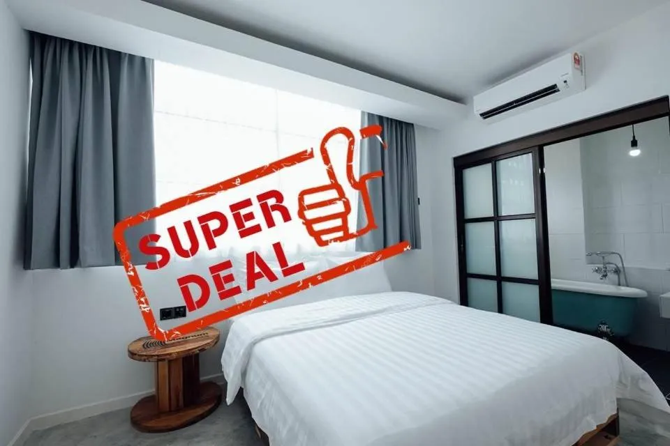 Bed in White Loft Hotel