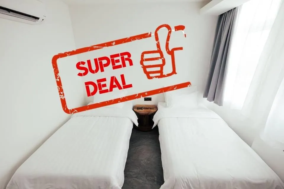 Bed in White Loft Hotel