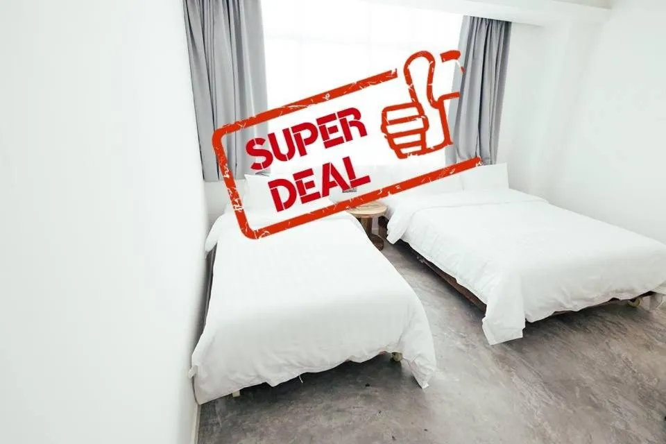 Bed in White Loft Hotel