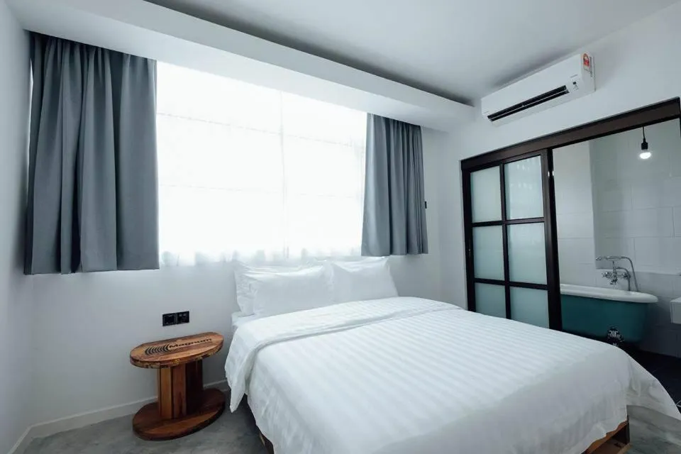 Bed in White Loft Hotel