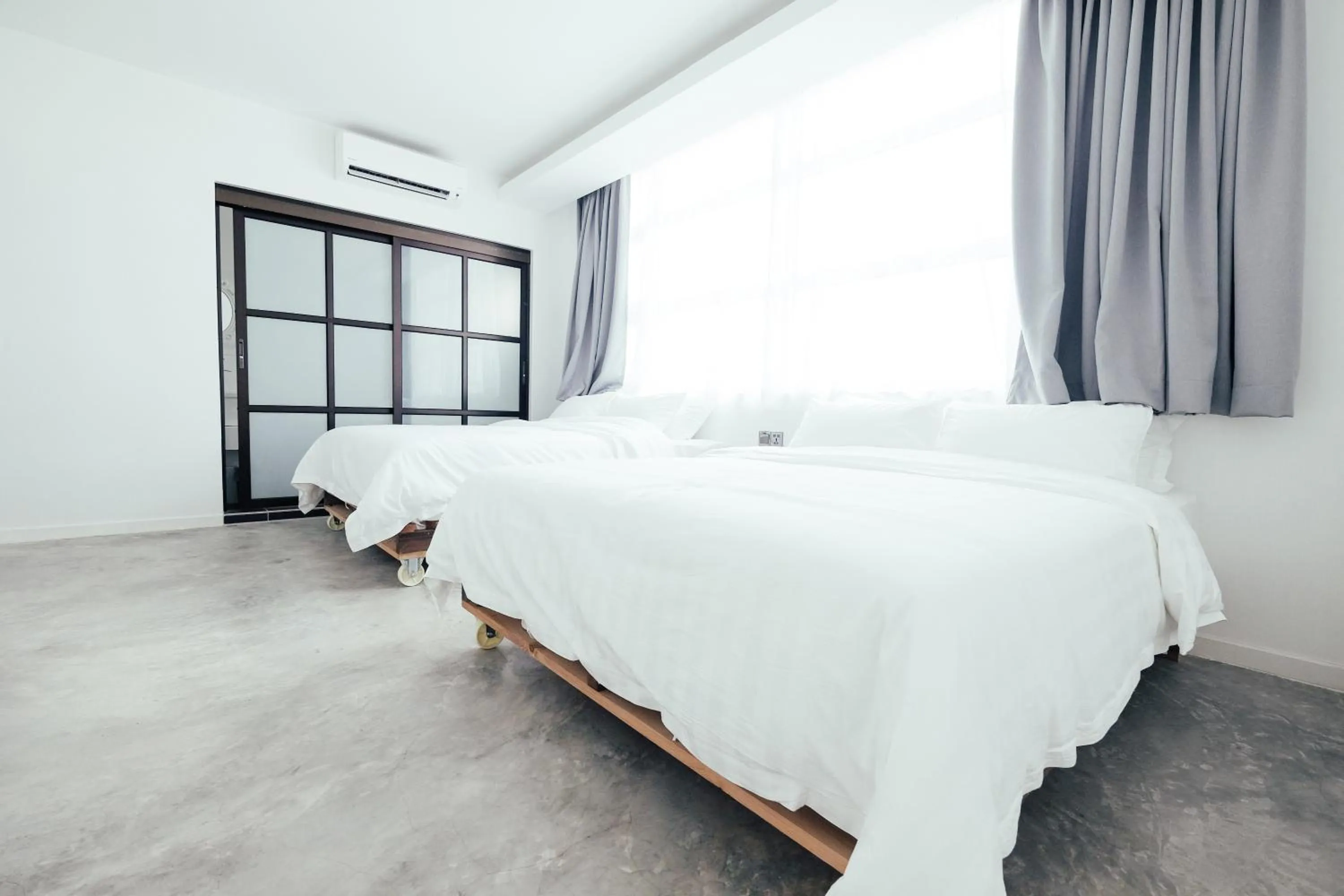 Bed in White Loft Hotel