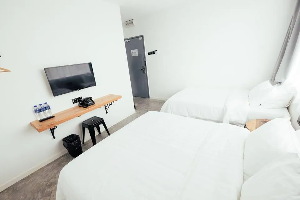 Bed in White Loft Hotel