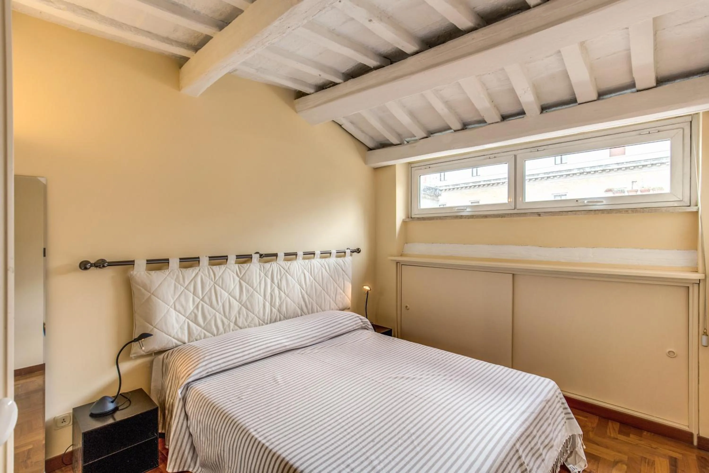 Bed in Trastevere Attic with Terrace