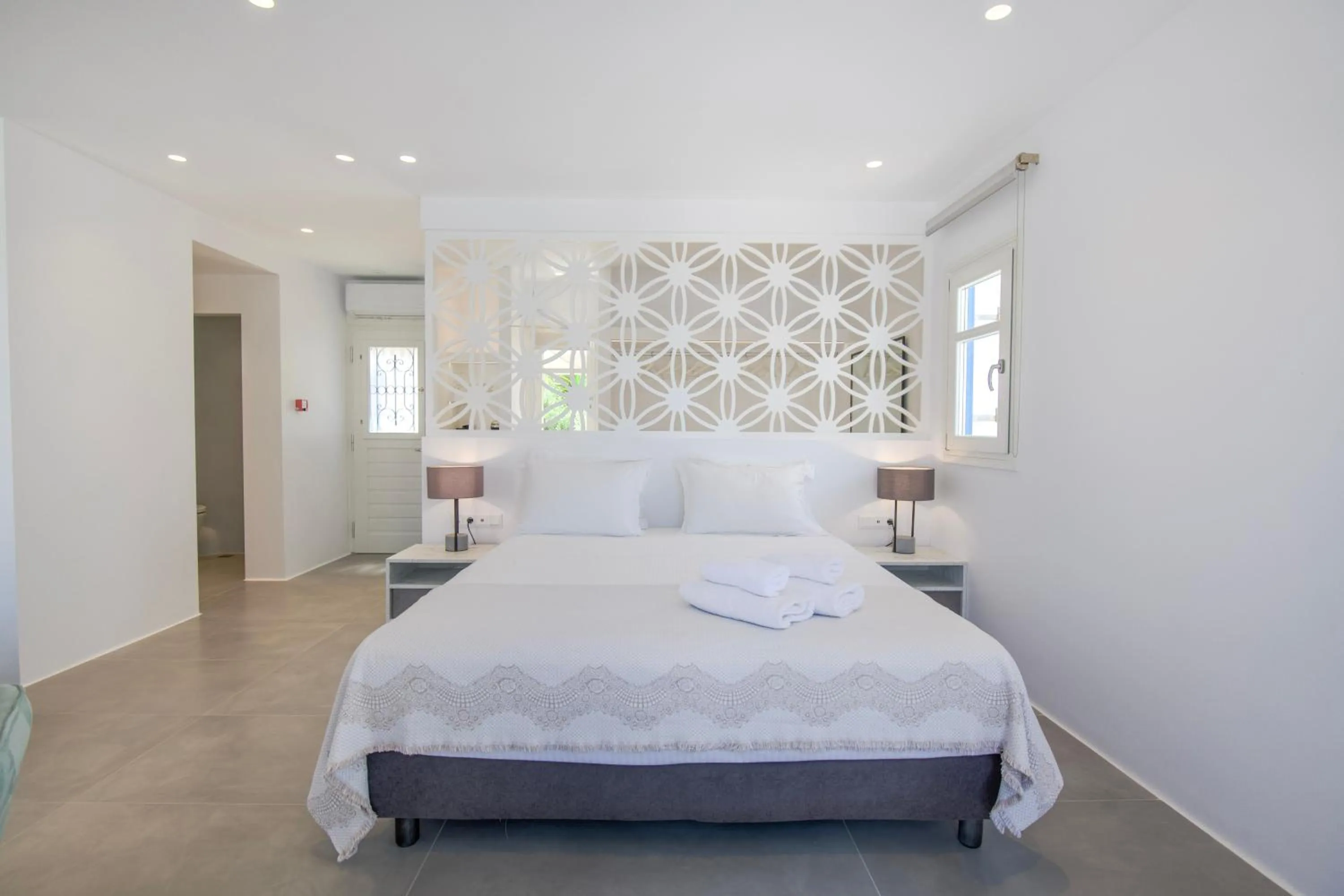 Bed in Alexandros Apartments