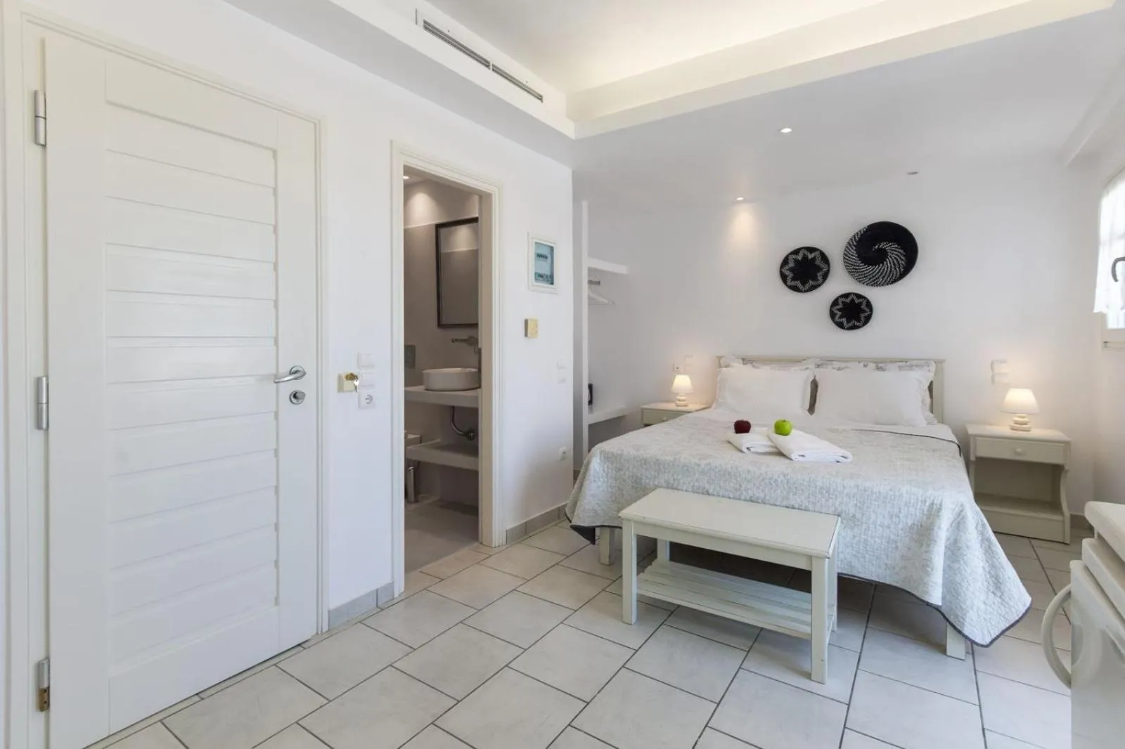 Bed in Alexandros Apartments