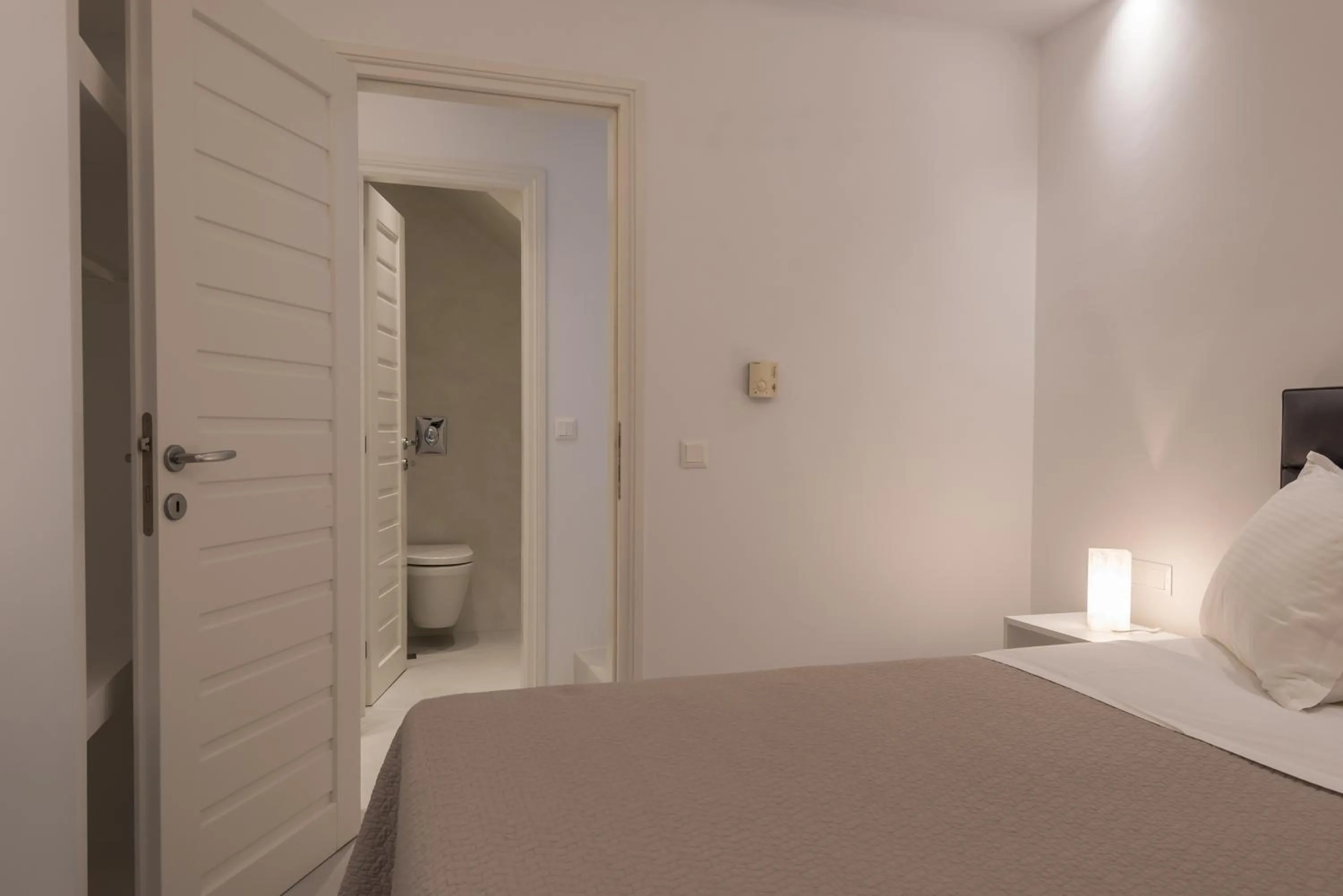 Bed in Alexandros Apartments