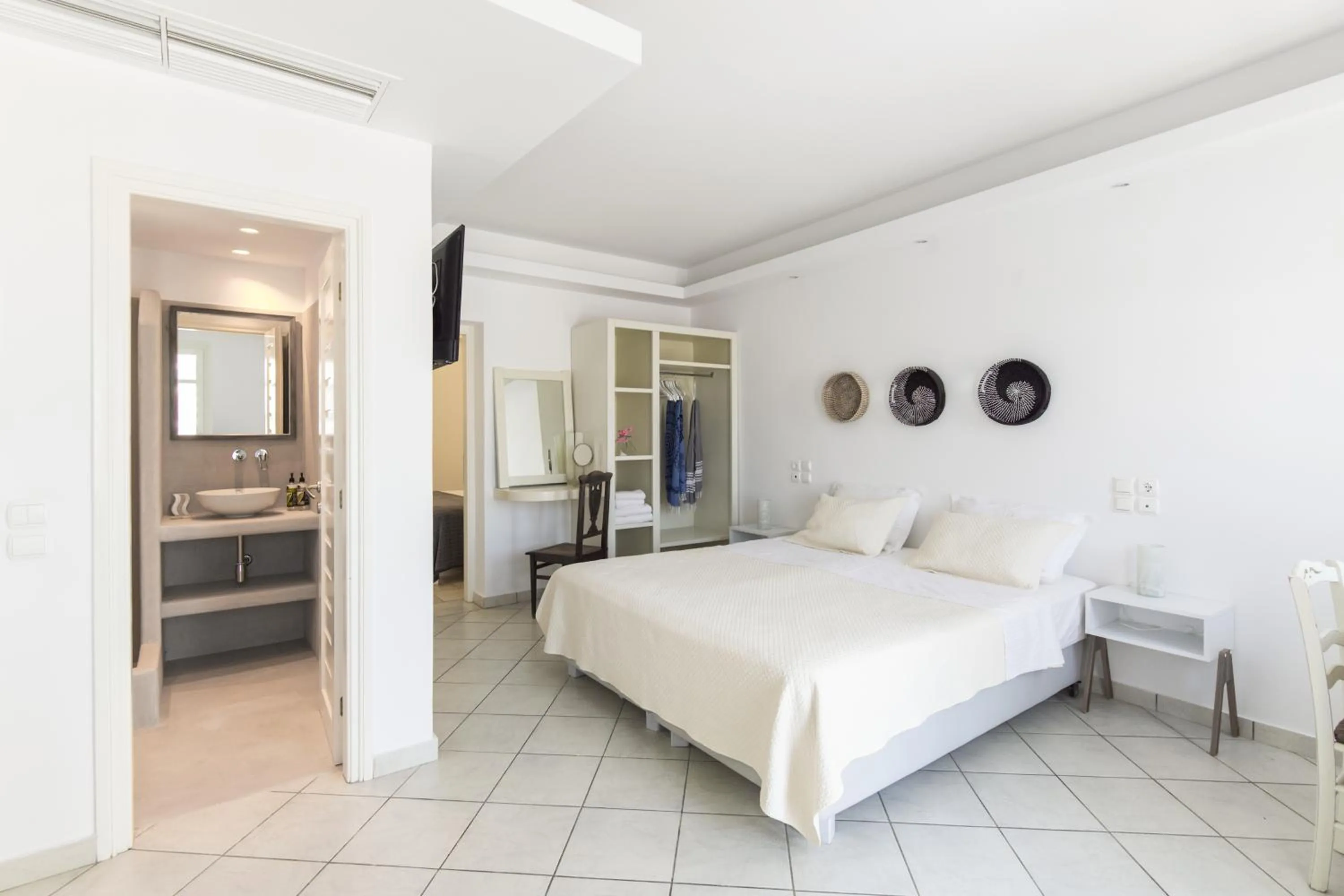 Bed in Alexandros Apartments