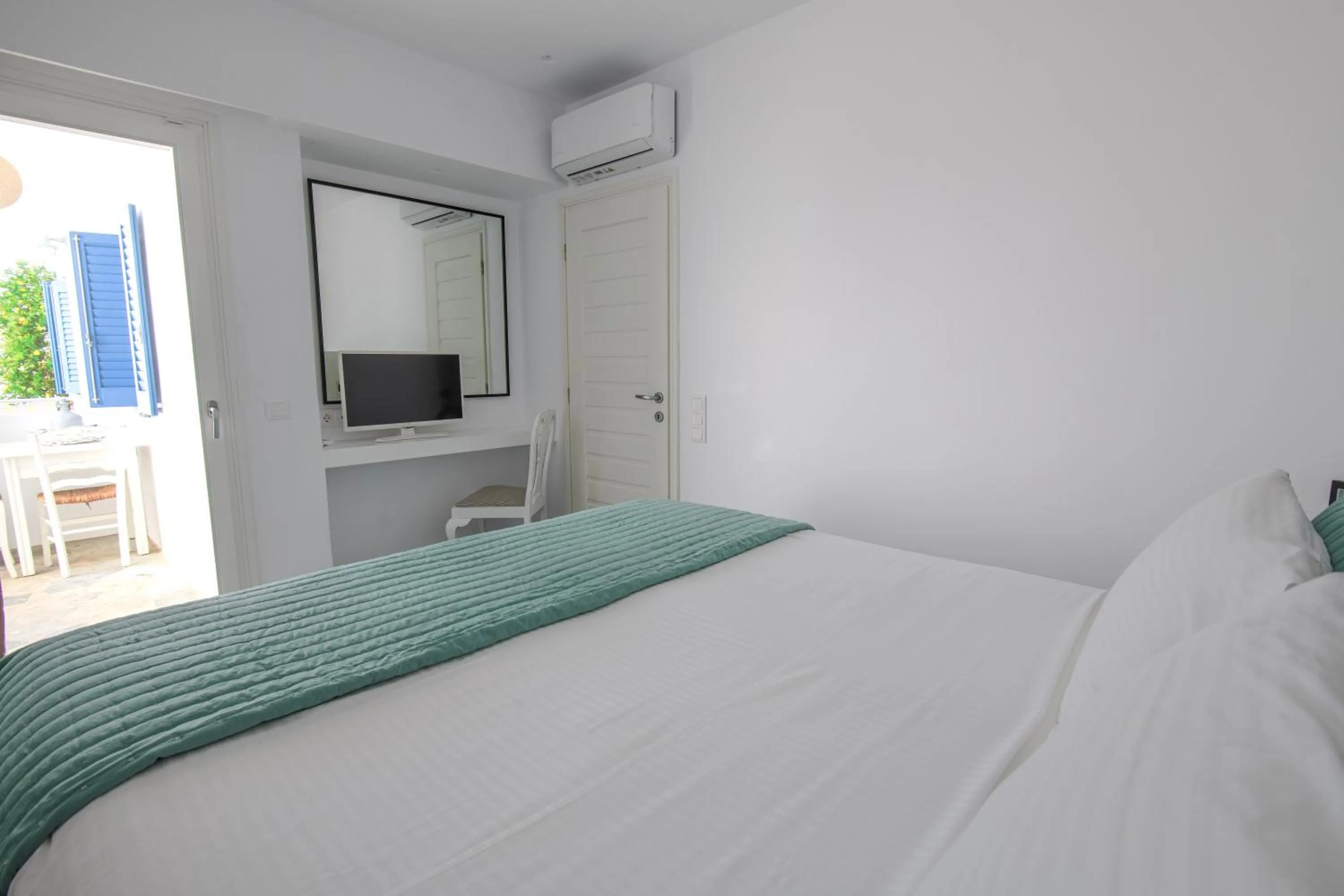 Bed in Alexandros Apartments