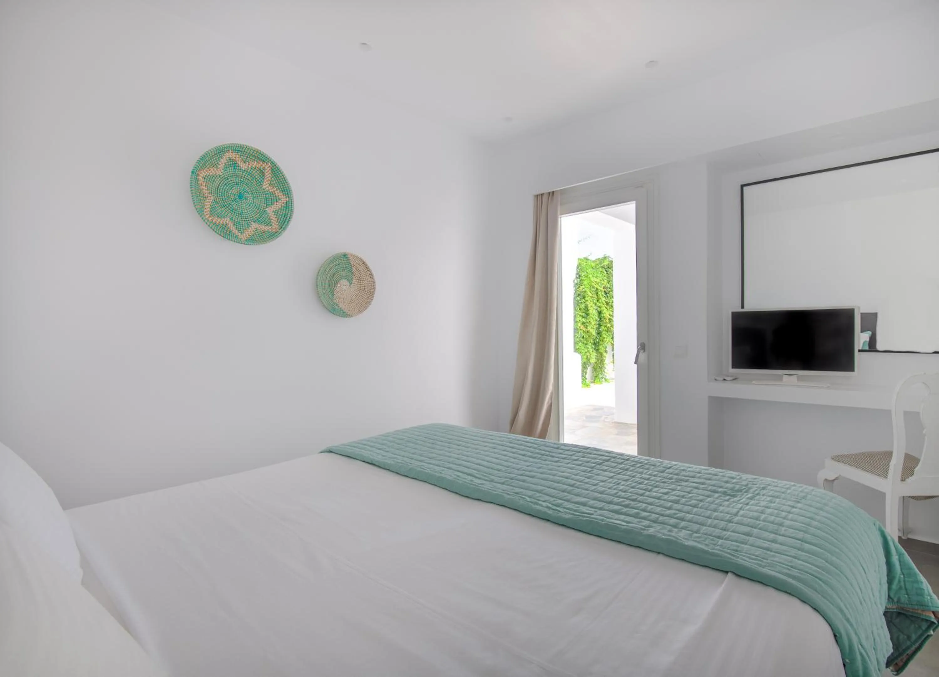 Bed in Alexandros Apartments