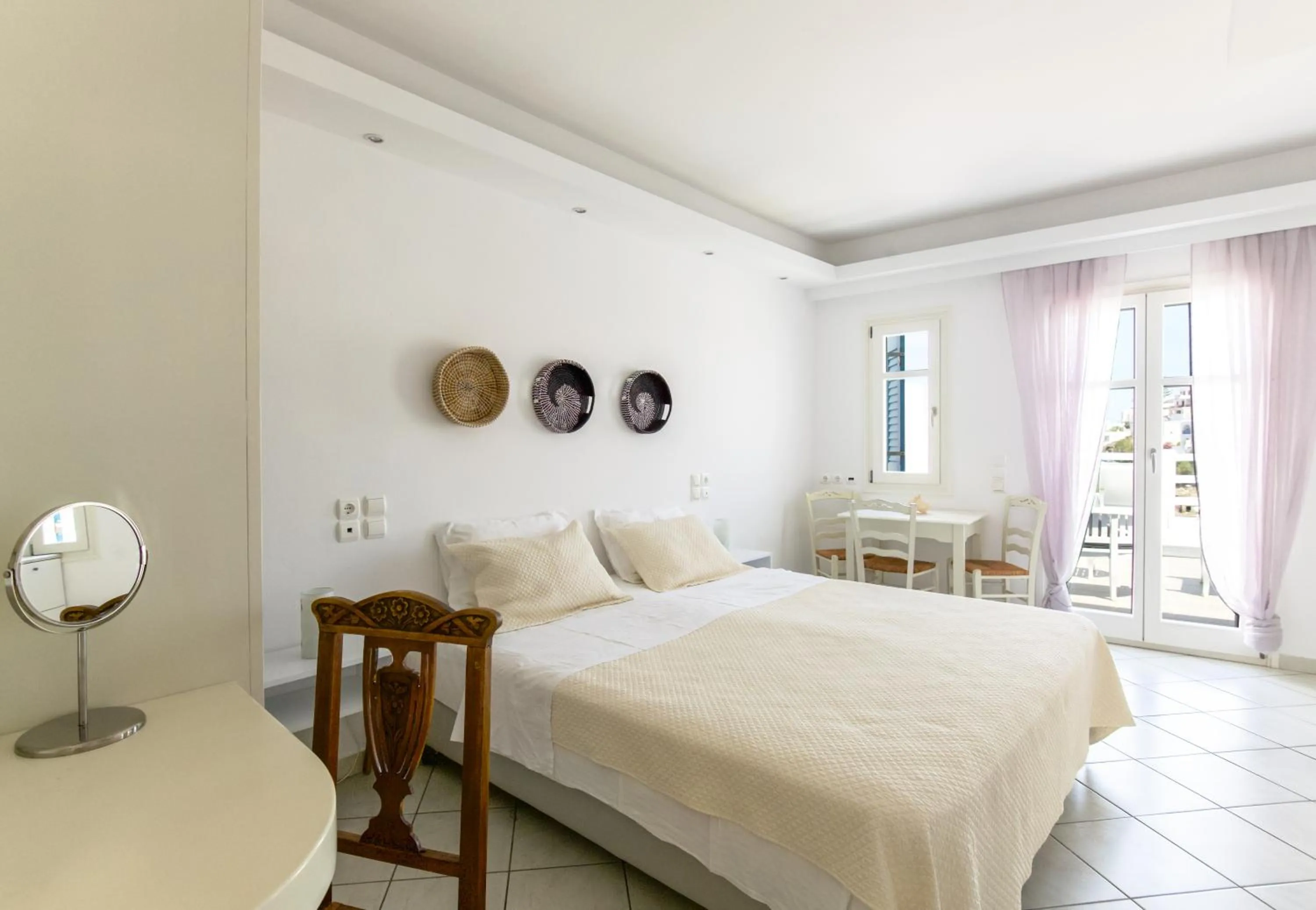 Bed in Alexandros Apartments