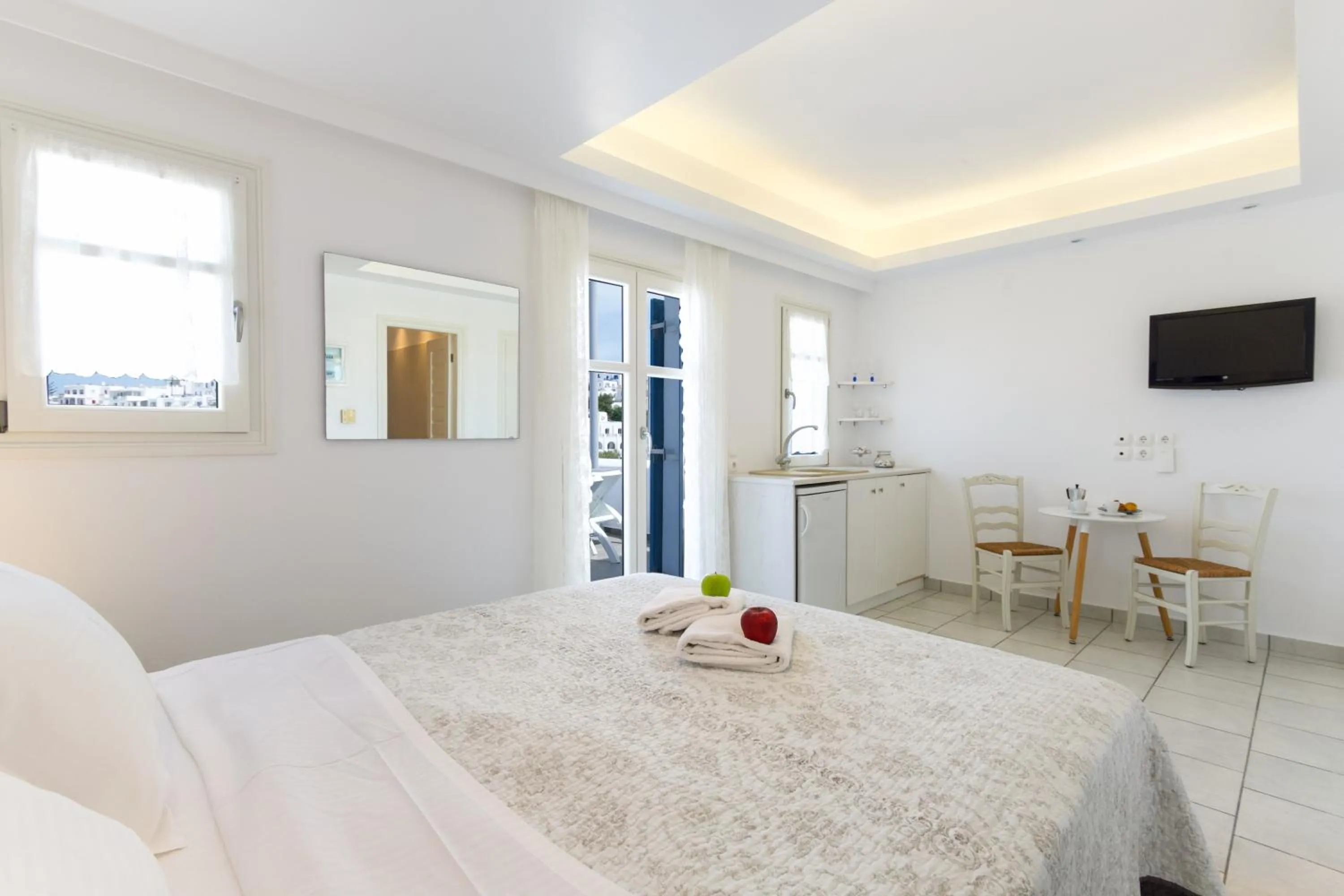 Bed in Alexandros Apartments