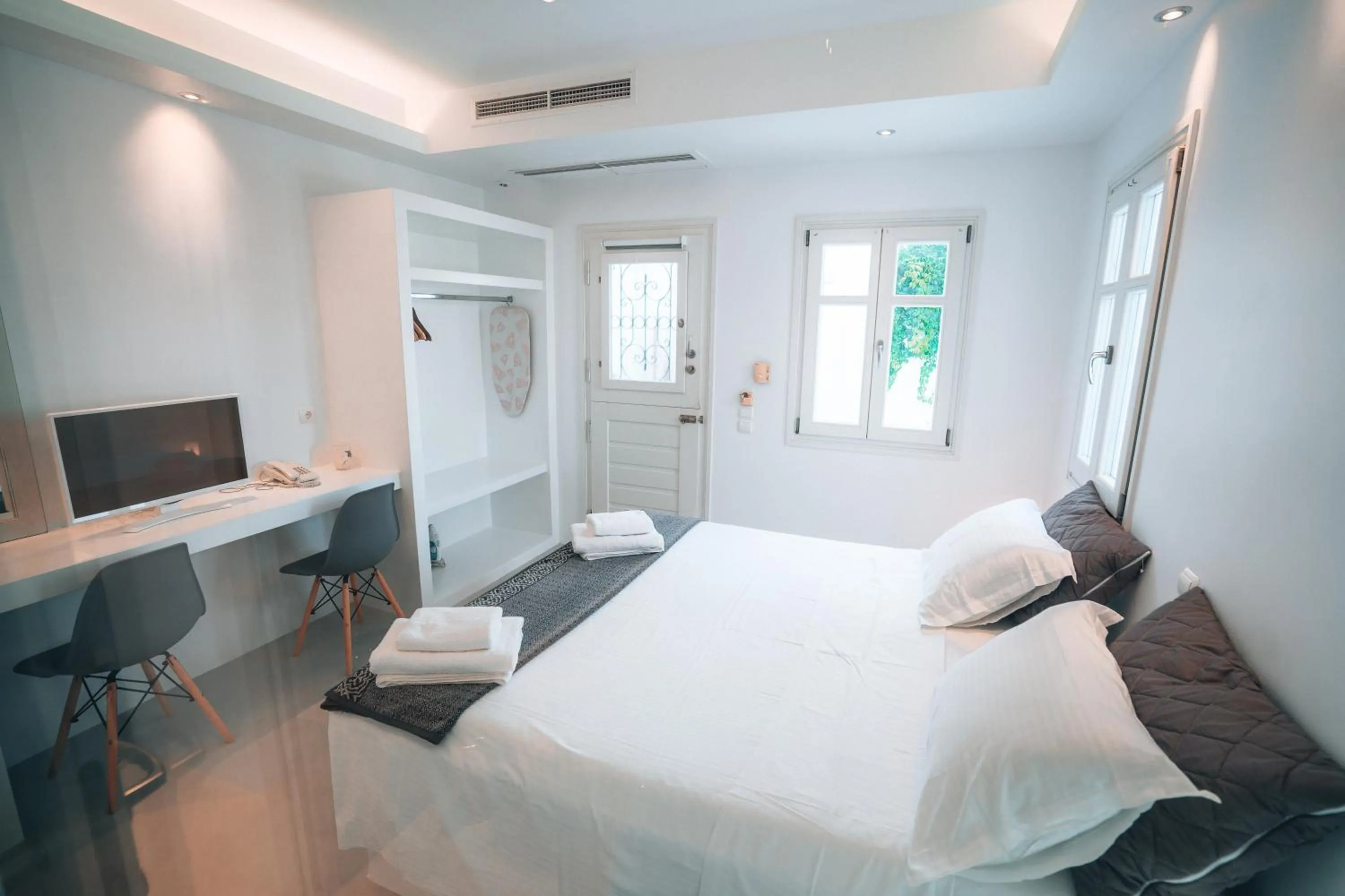 Bed in Alexandros Apartments