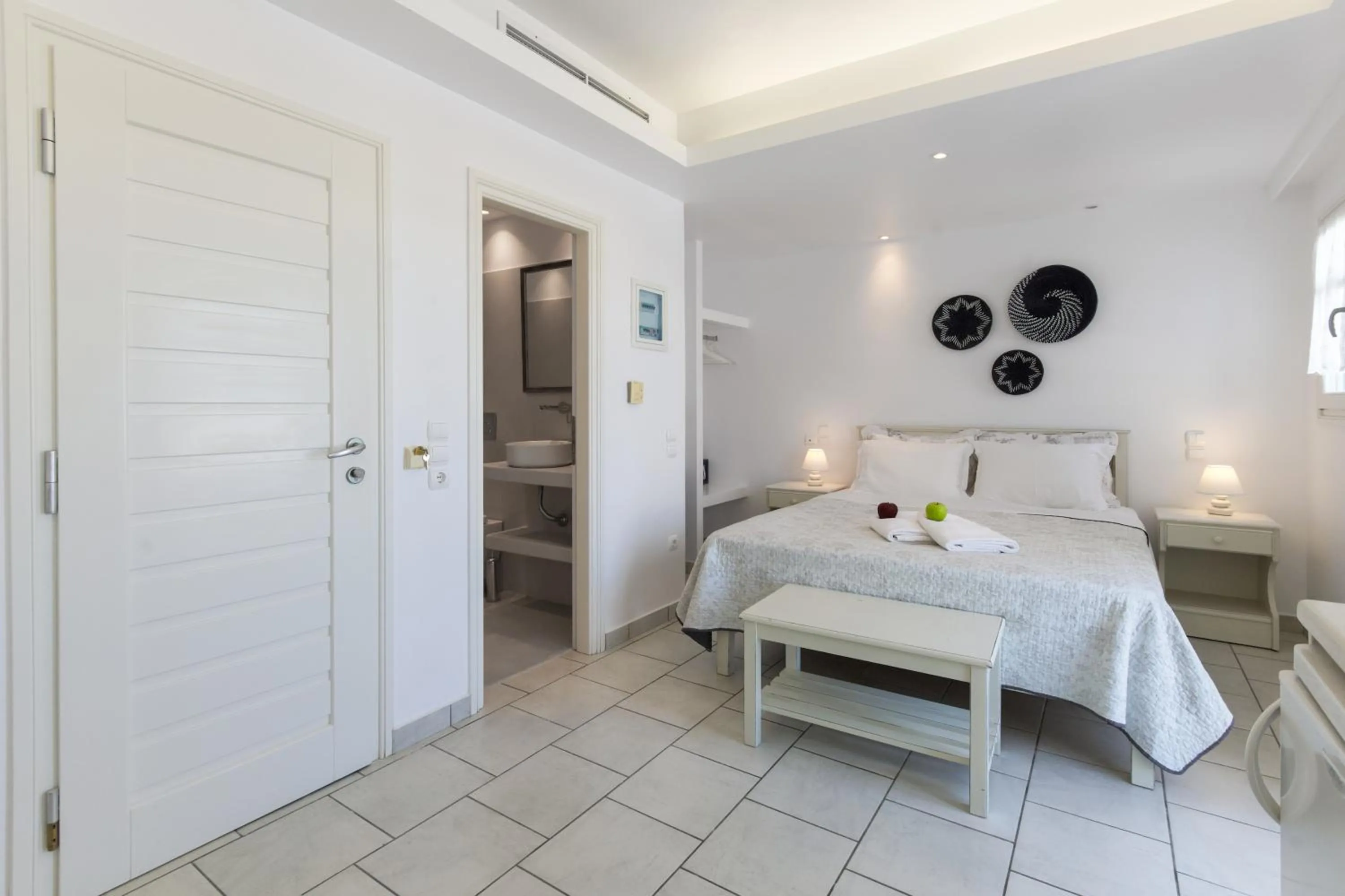 Bed in Alexandros Apartments