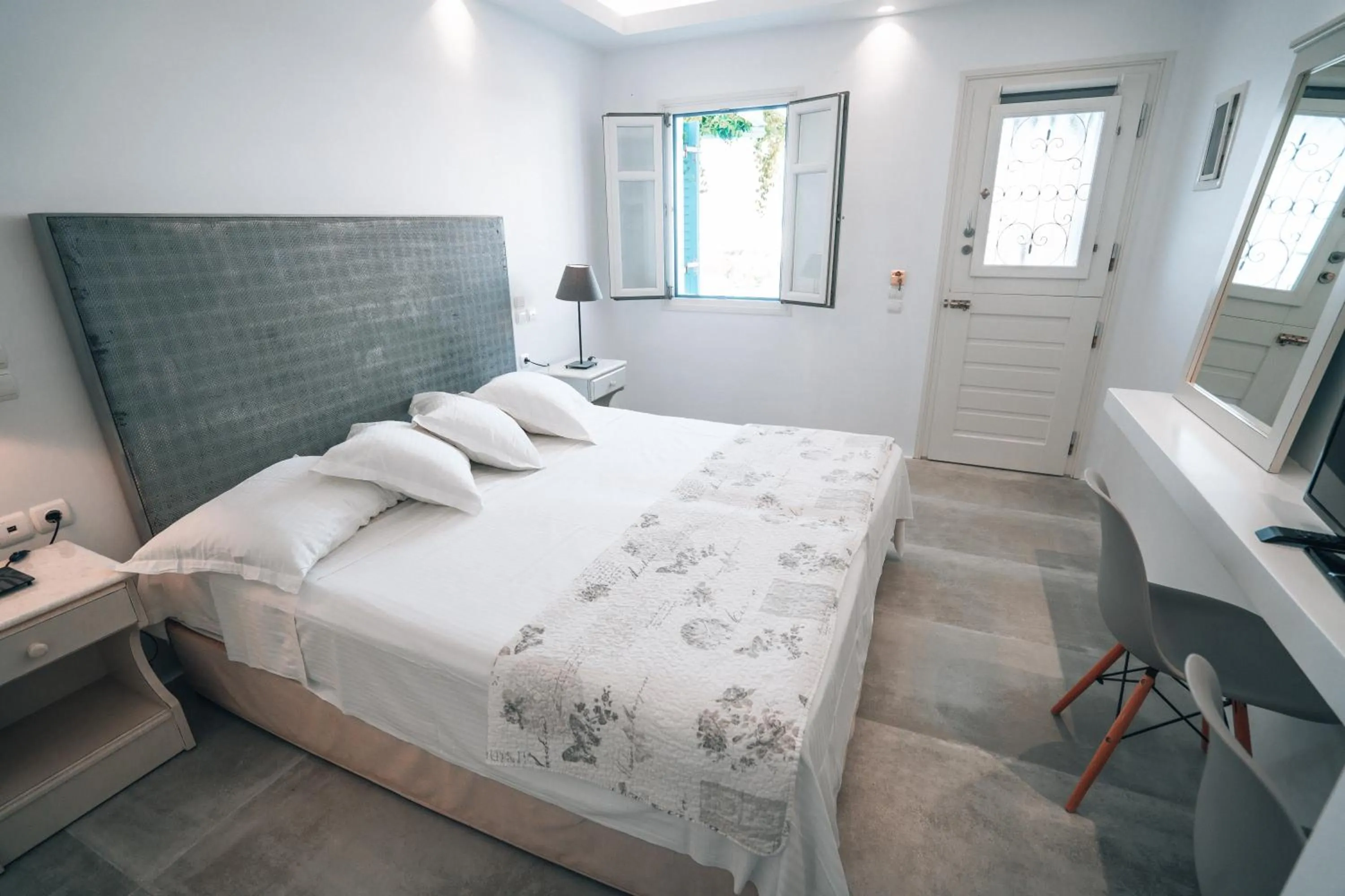 Bed in Alexandros Apartments