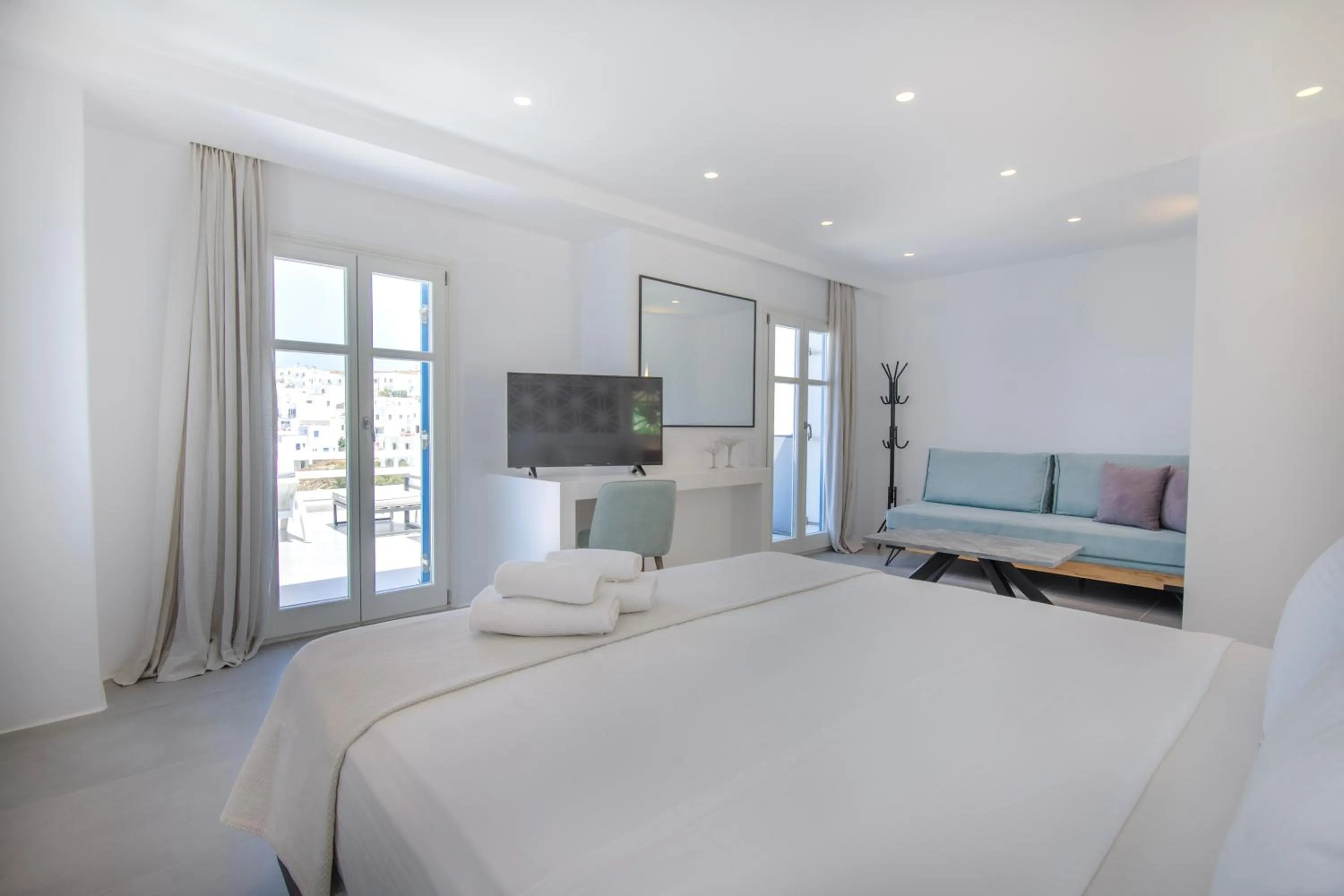 Bed in Alexandros Apartments