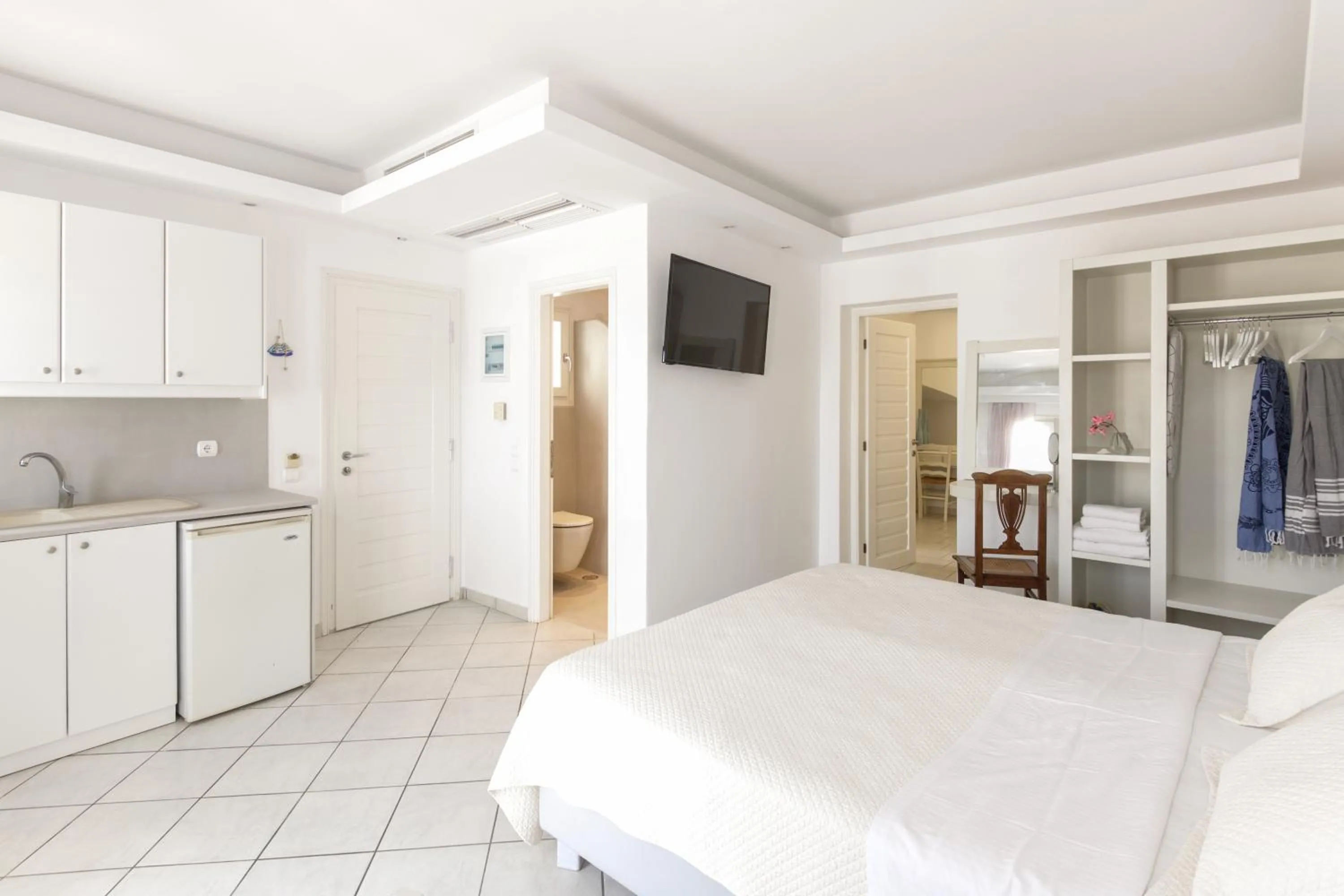 Bed in Alexandros Apartments