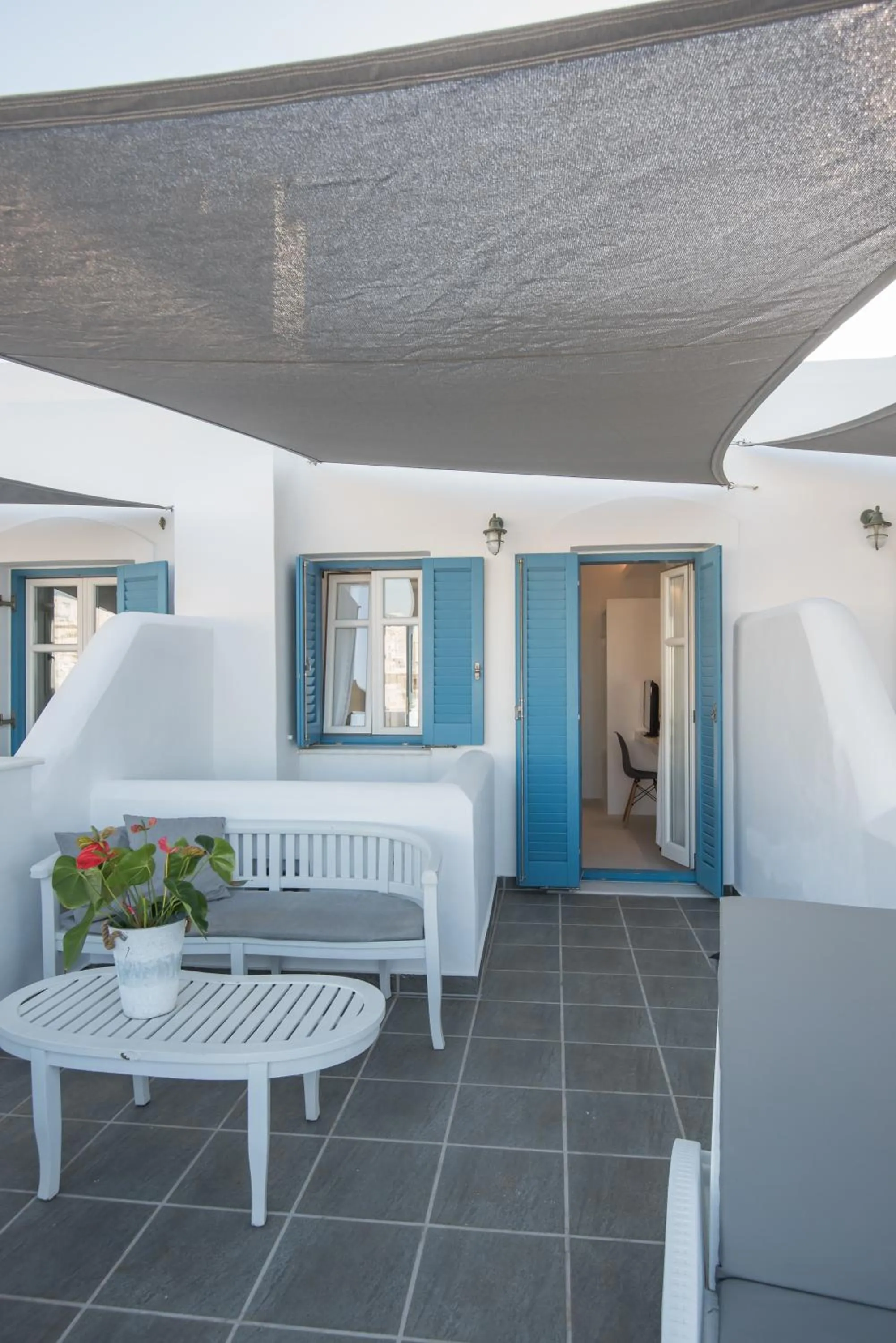 Bed in Alexandros Apartments