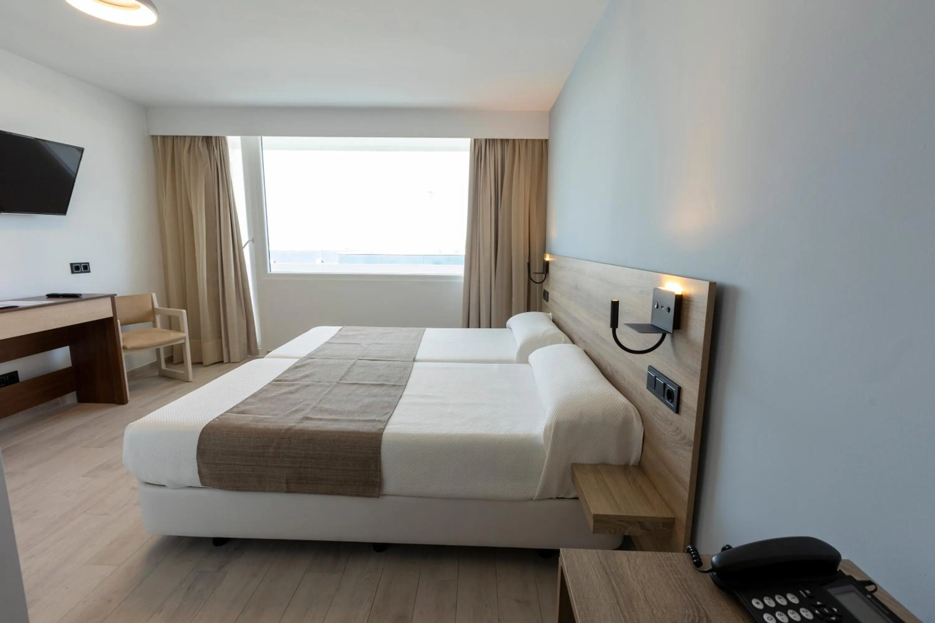 Bed in Hotel Flamero