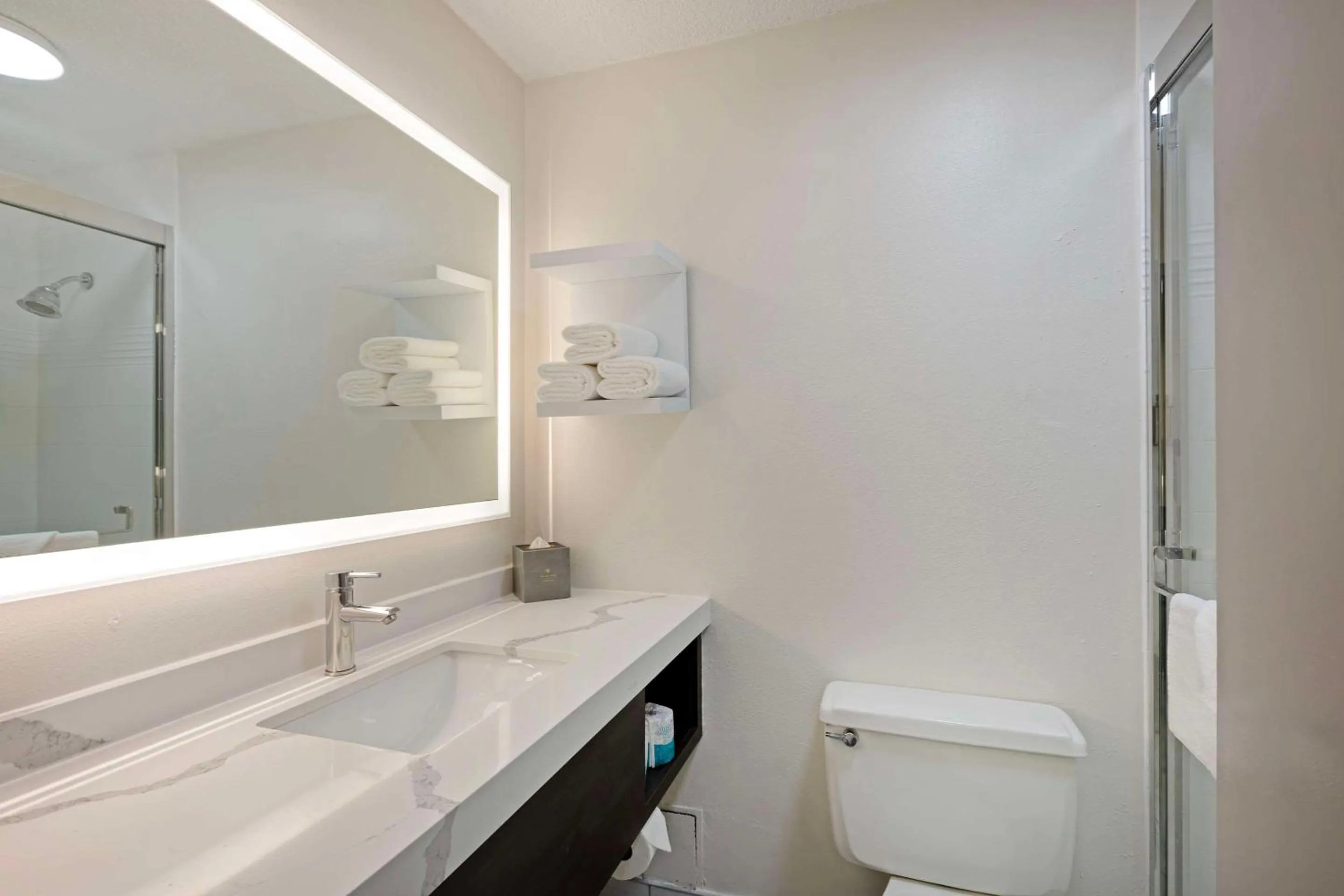 Bedroom in The Lux Hotel & Conference Center, Ascend Hotel Collection