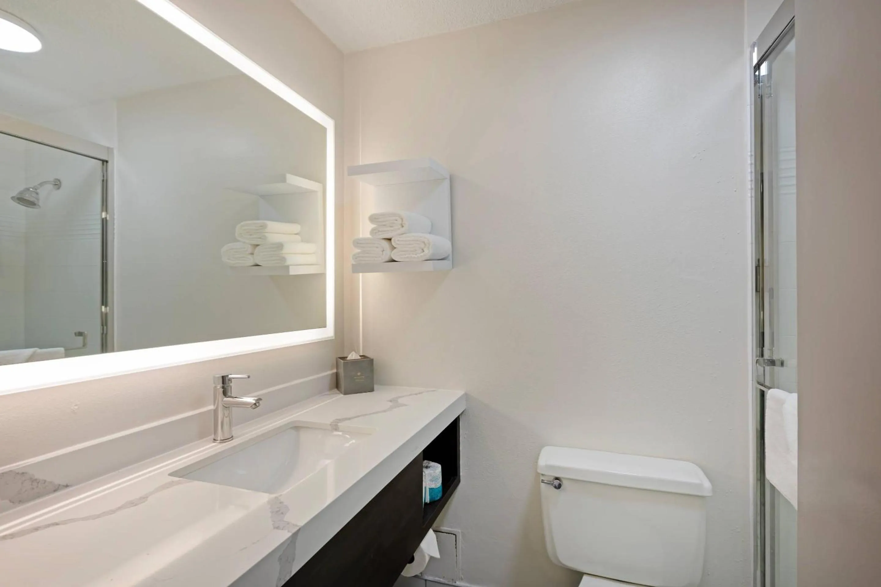 Bedroom in The Lux Hotel & Conference Center, an Ascend Collection Hotel