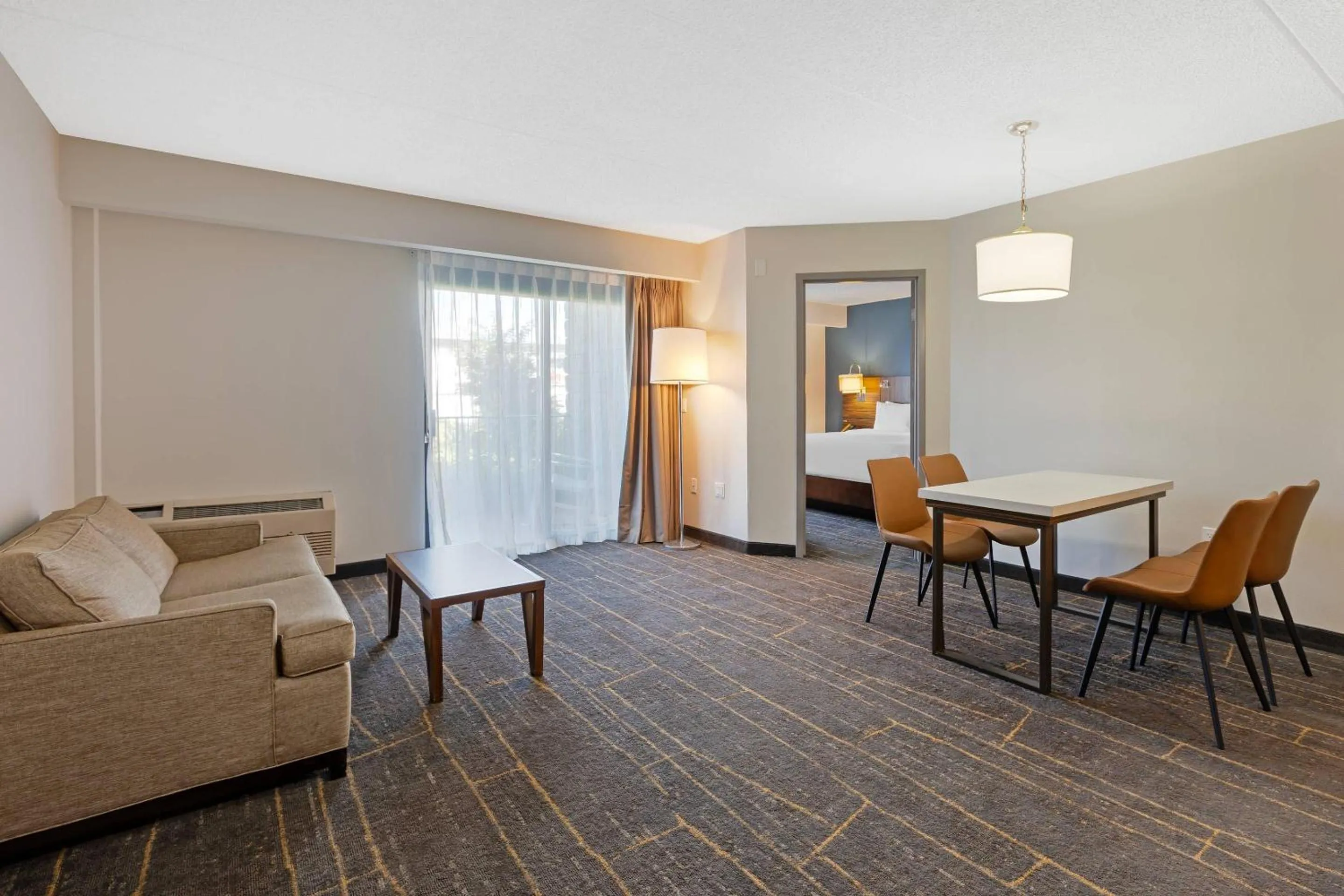 Bedroom in The Lux Hotel & Conference Center, an Ascend Collection Hotel