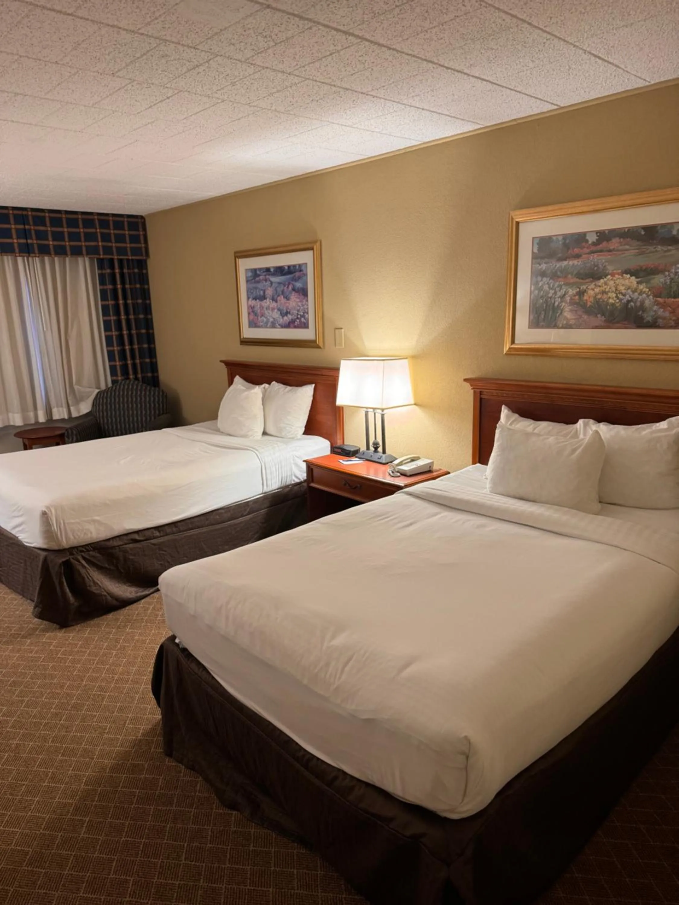 Bed in Clarion Inn Frederick Event Center
