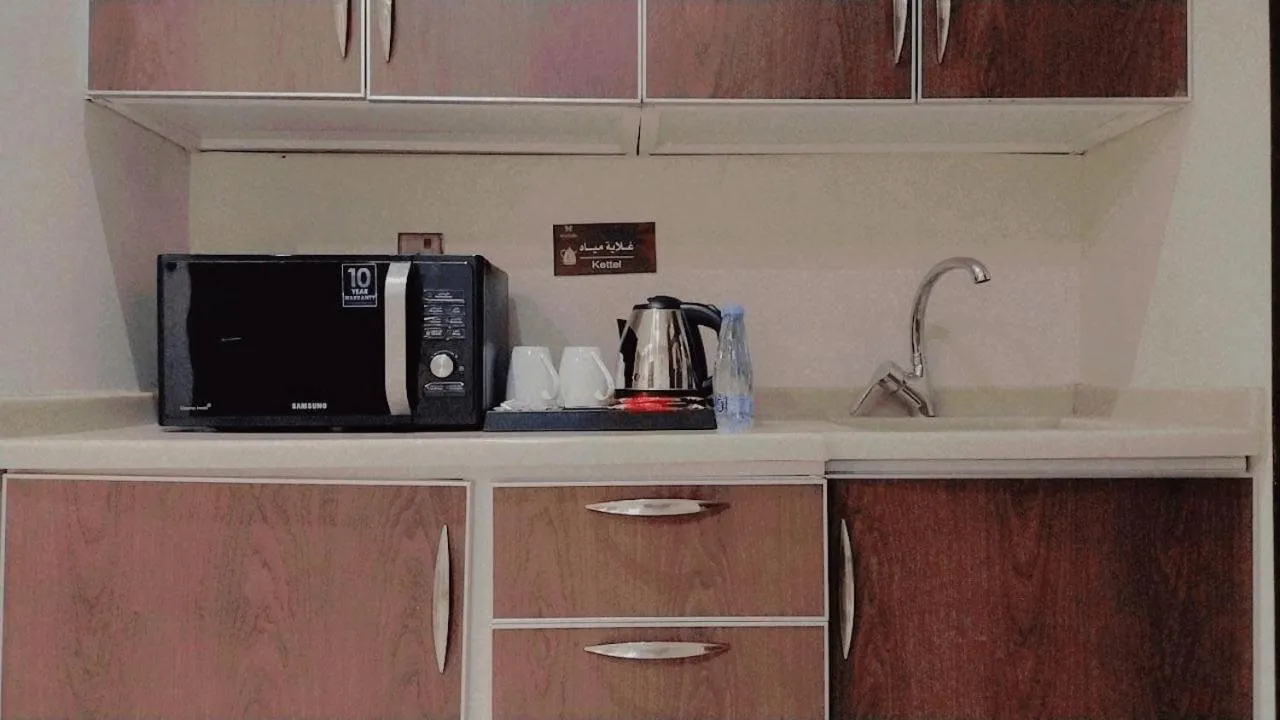 Kitchen or kitchenette in Daif Inn Serviced Apartments - Qurtubah