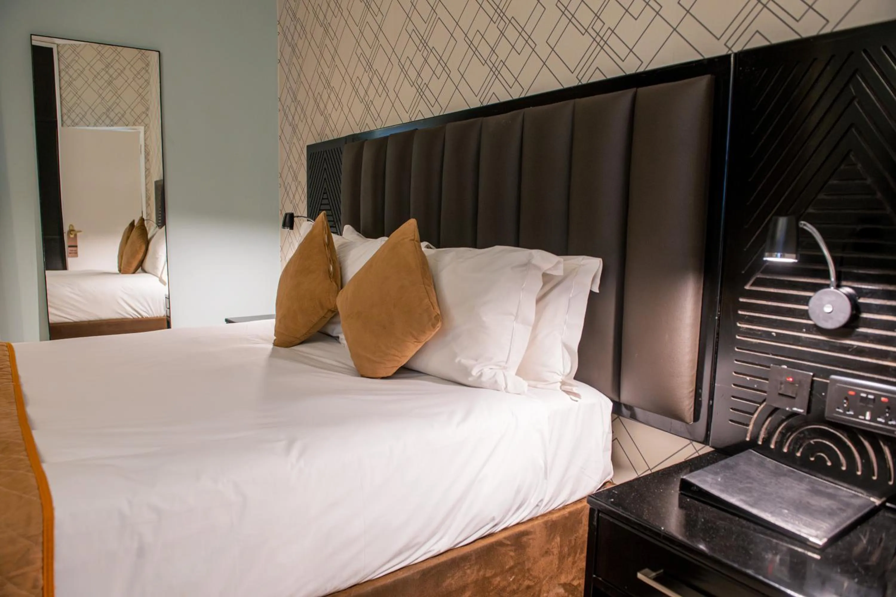 Bed in New Ambassador Hotel