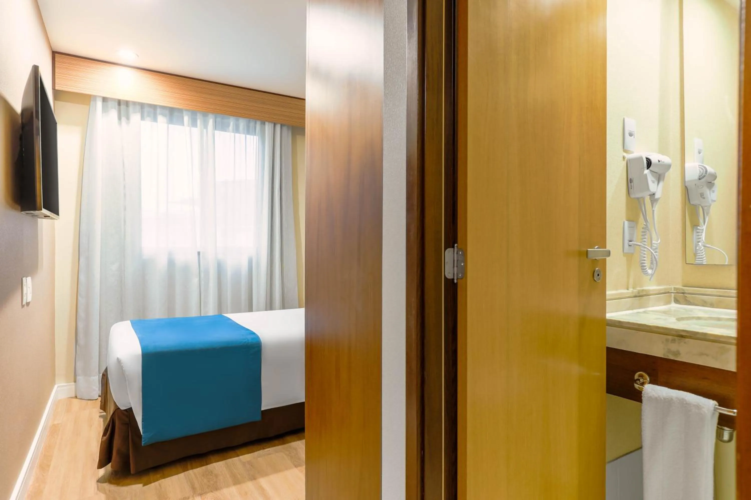 Bed in Wyndham Sao Paulo Ibirapuera Convention Plaza