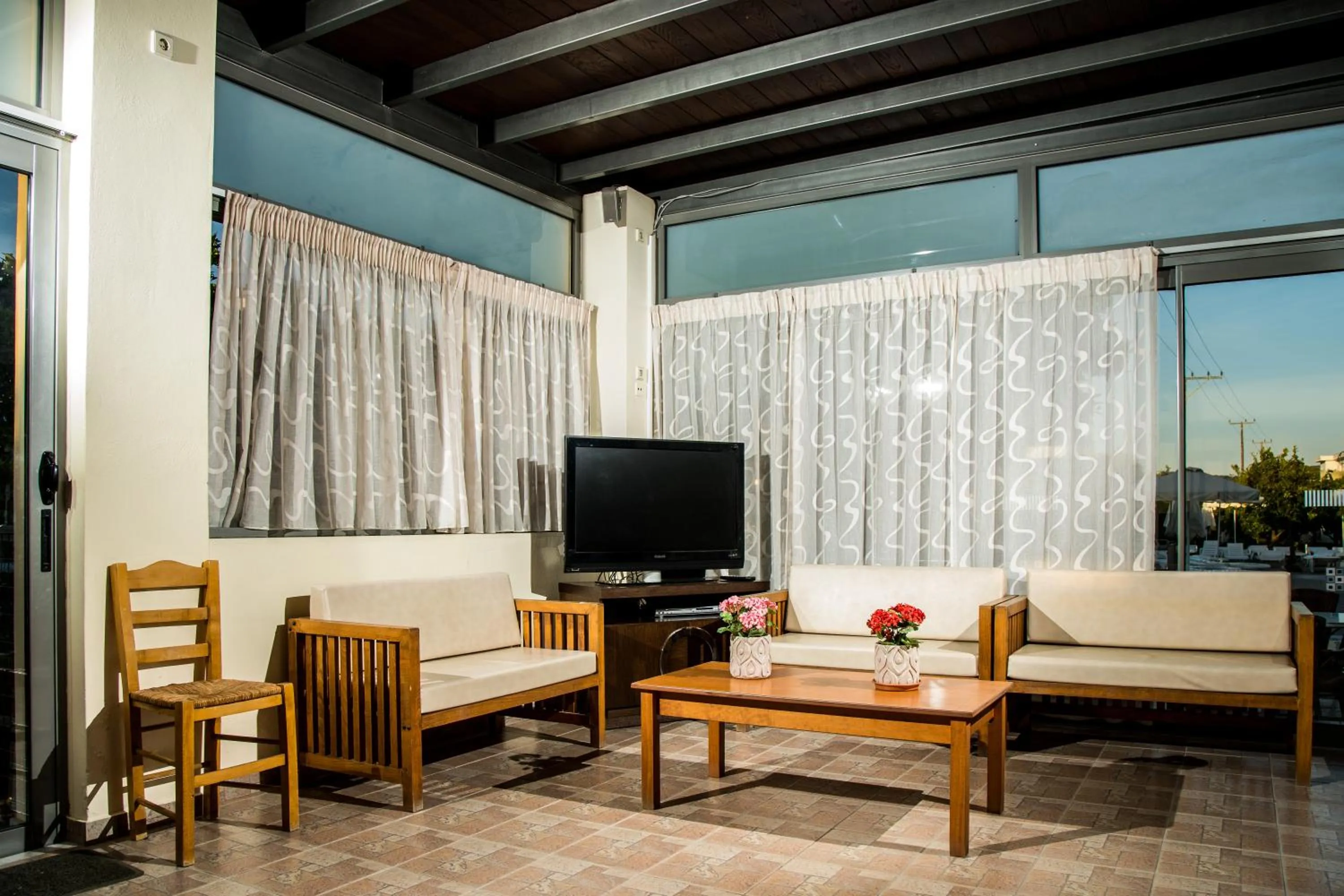 Communal lounge/ TV room in Ilyssion Holidays Hotel