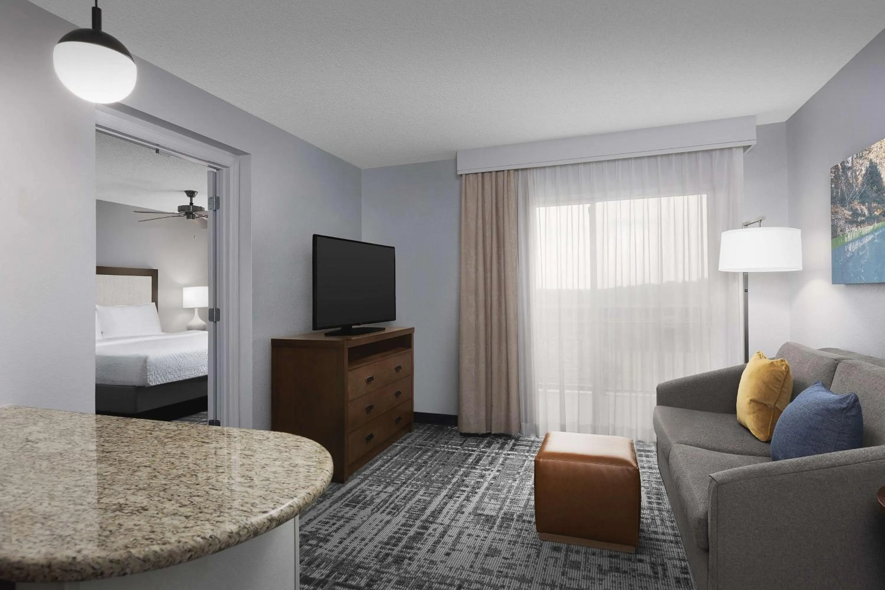 Living room, Bed in Homewood Suites by Hilton Raleigh-Durham Airport at RTP