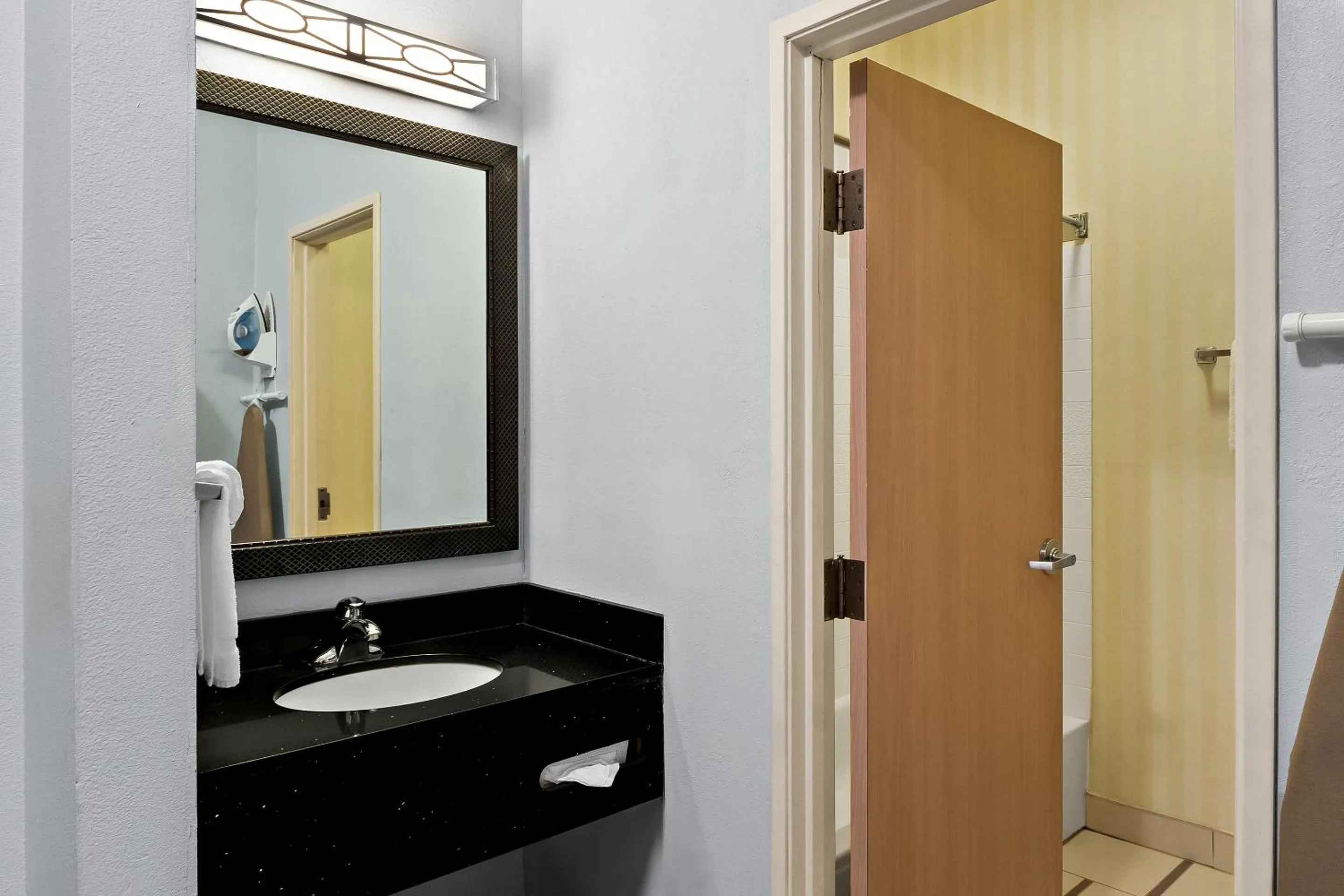 Bathroom in HomeTowne Studios by Red Roof East Lansing - Okemos