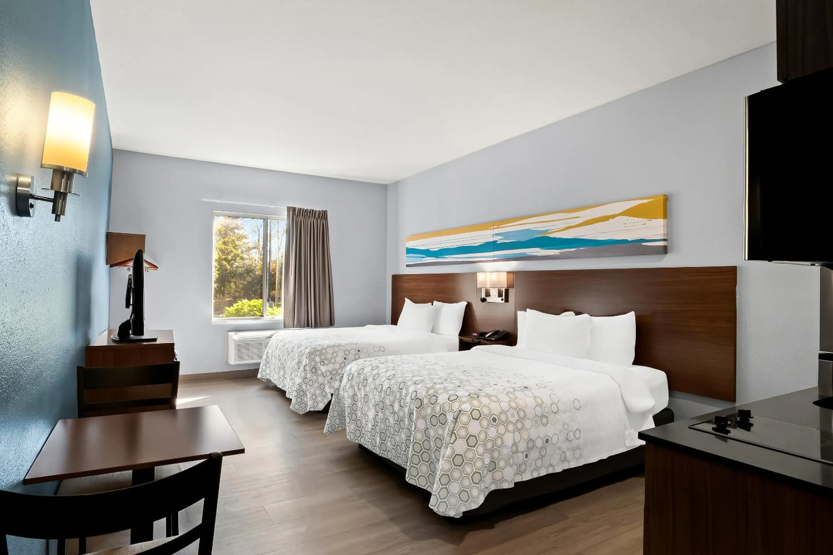 Photo of the whole room, Bed in HomeTowne Studios by Red Roof East Lansing - Okemos