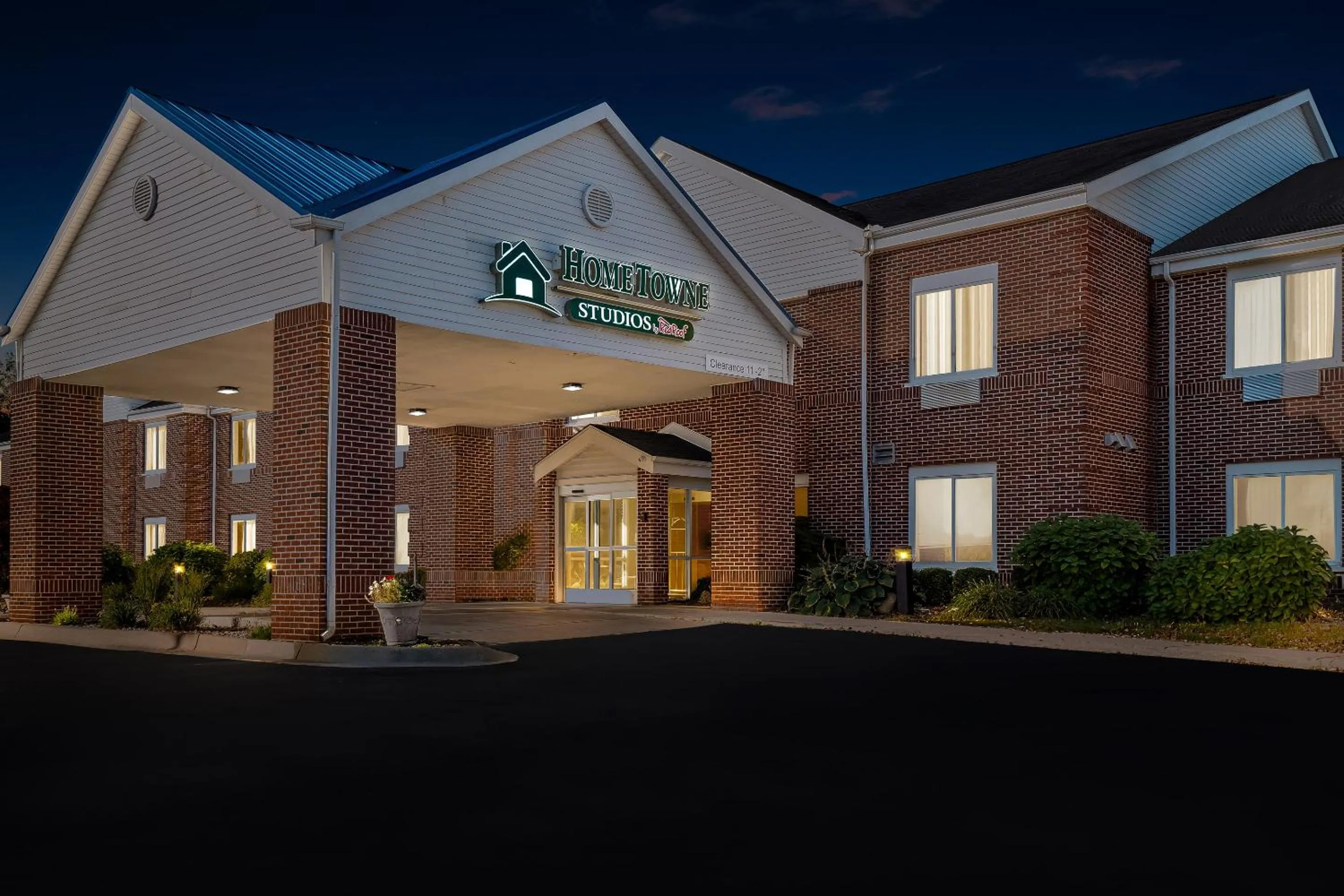 Property building in HomeTowne Studios by Red Roof East Lansing - Okemos