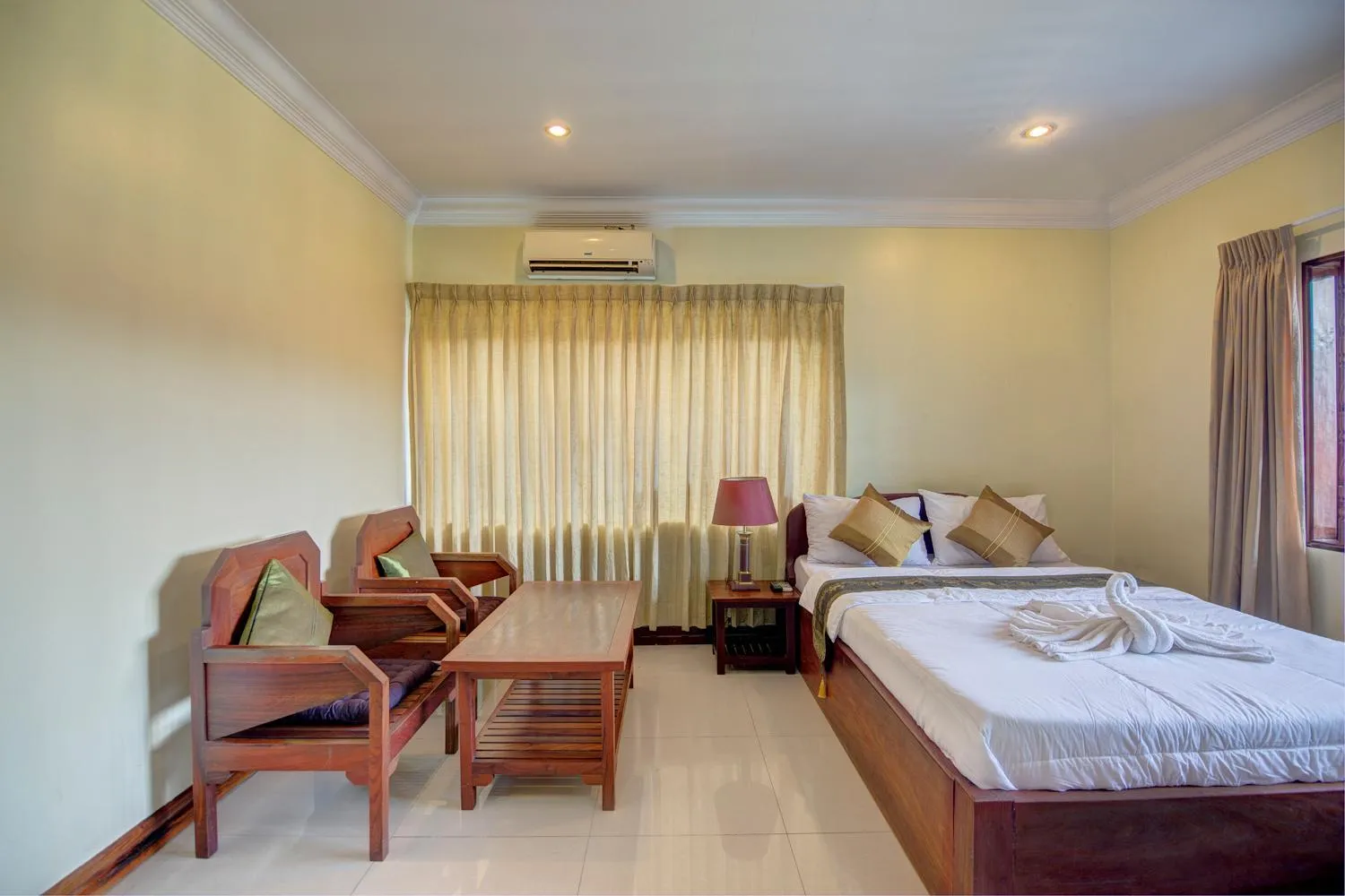 Seating area, Bed in DV Angkor Villa