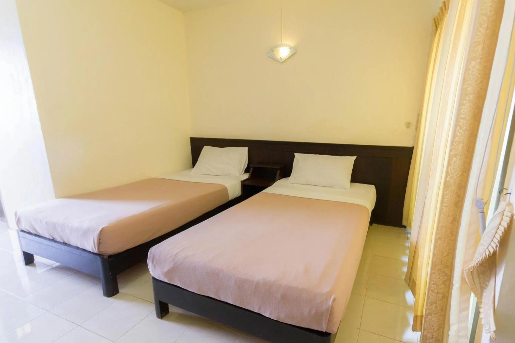 Bed in Mont Talay Hotel