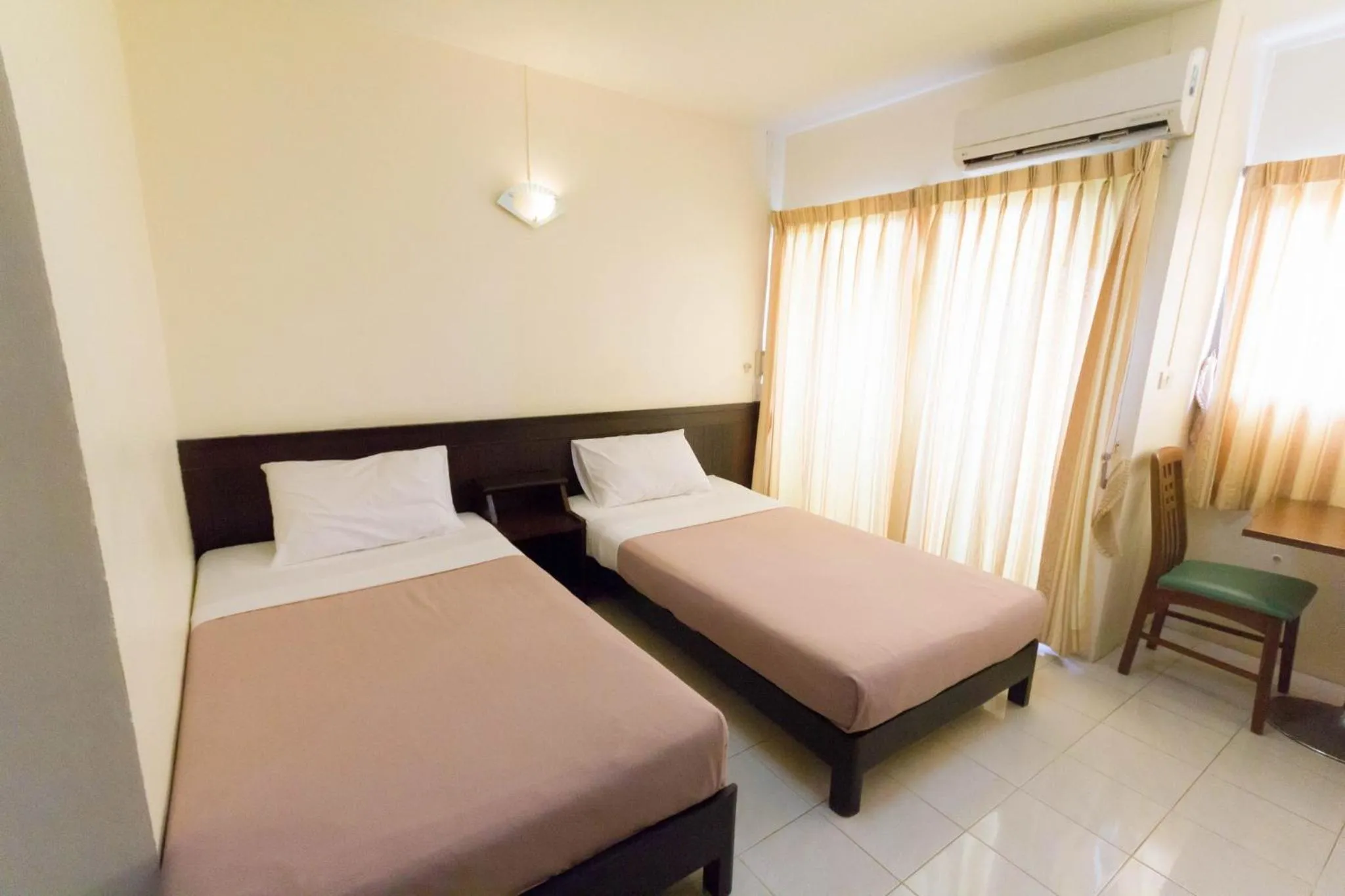 Bed in Mont Talay Hotel