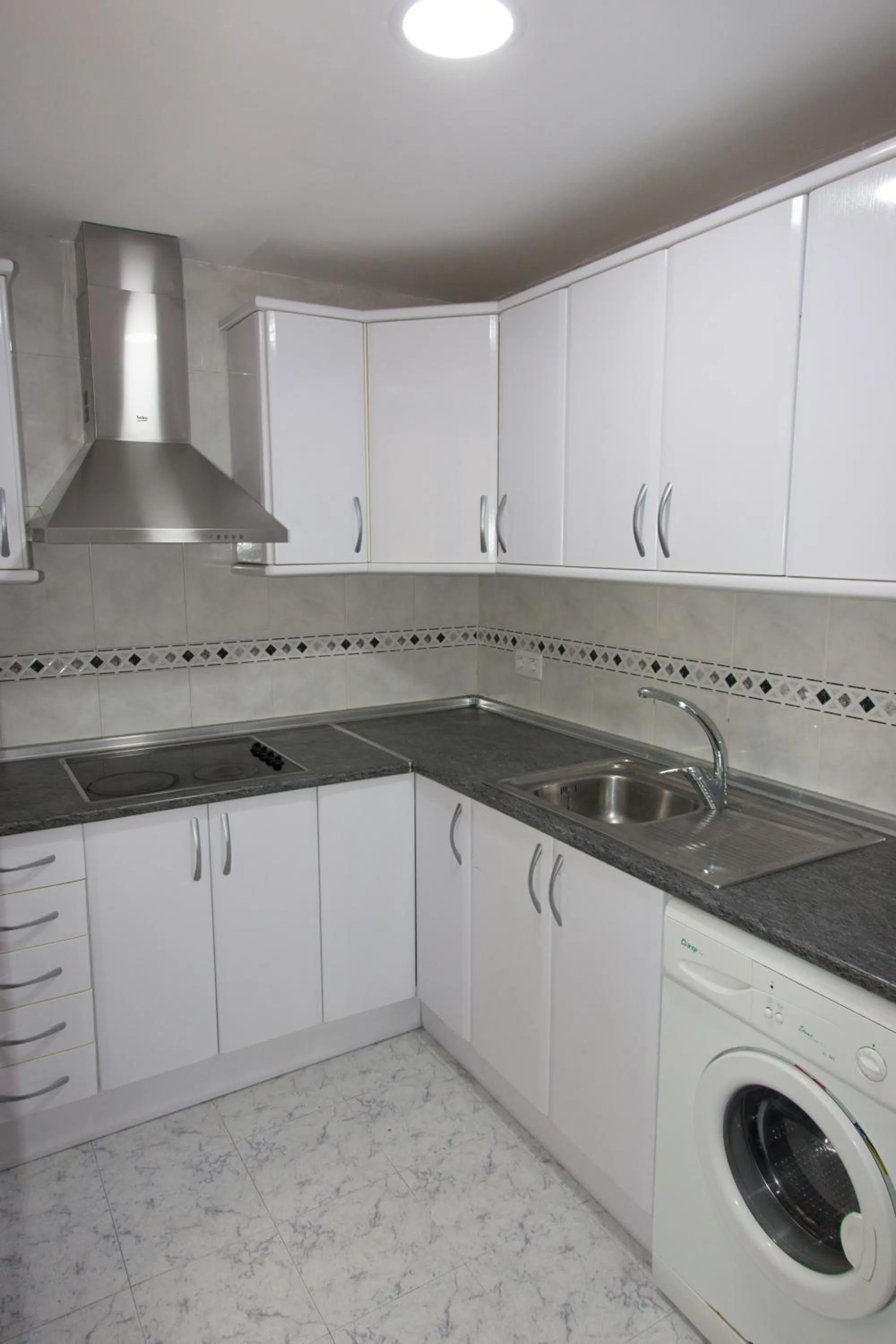 Kitchen or kitchenette in Apartamentos Río Guadalaviar