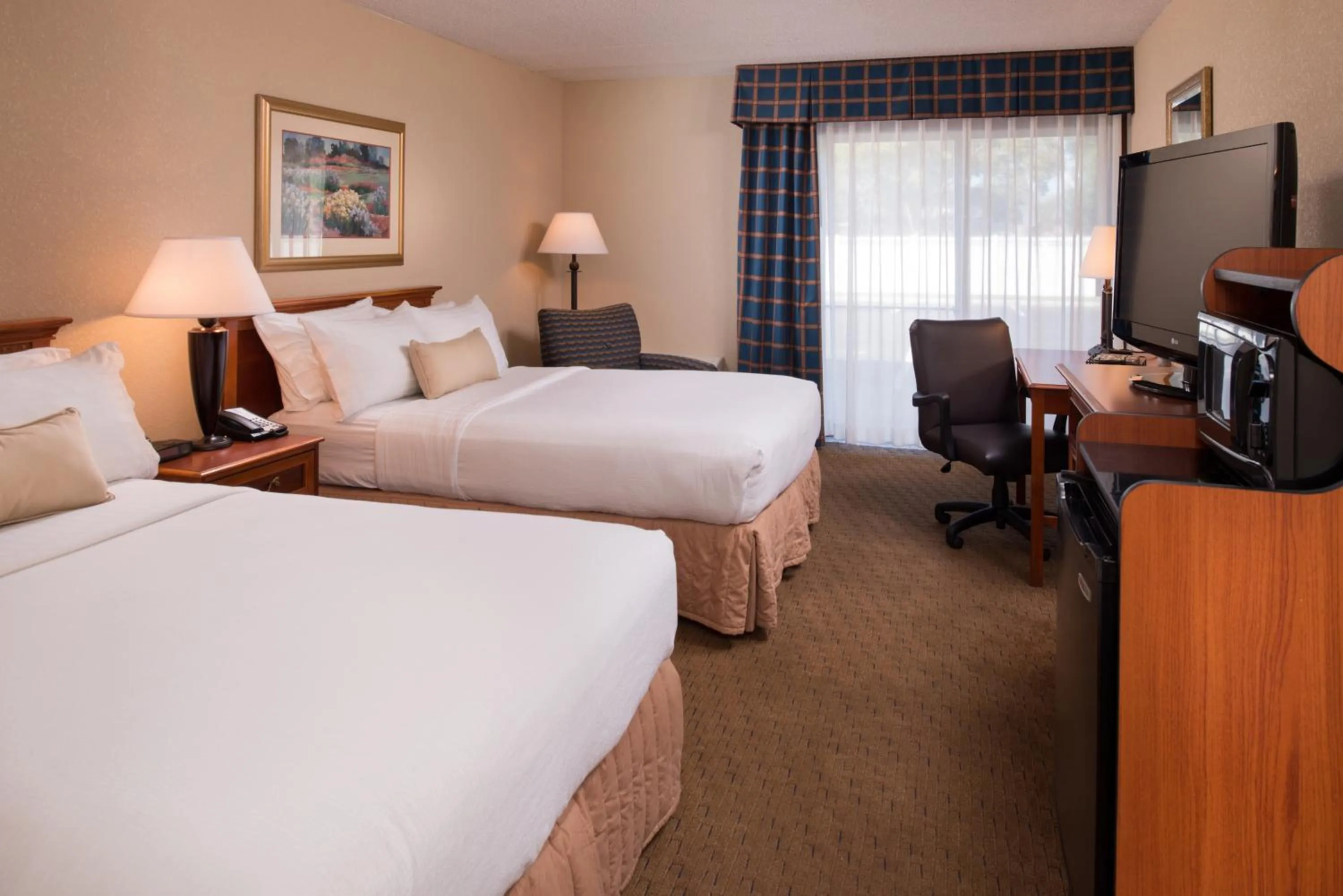 Bed in Ramada by Wyndham Midtown Grand Island
