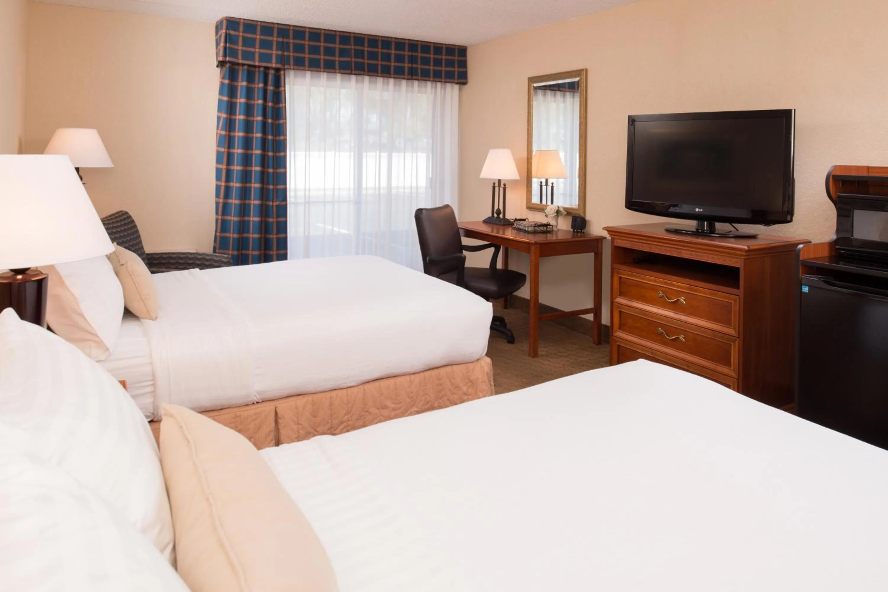 Bed in Ramada by Wyndham Midtown Grand Island