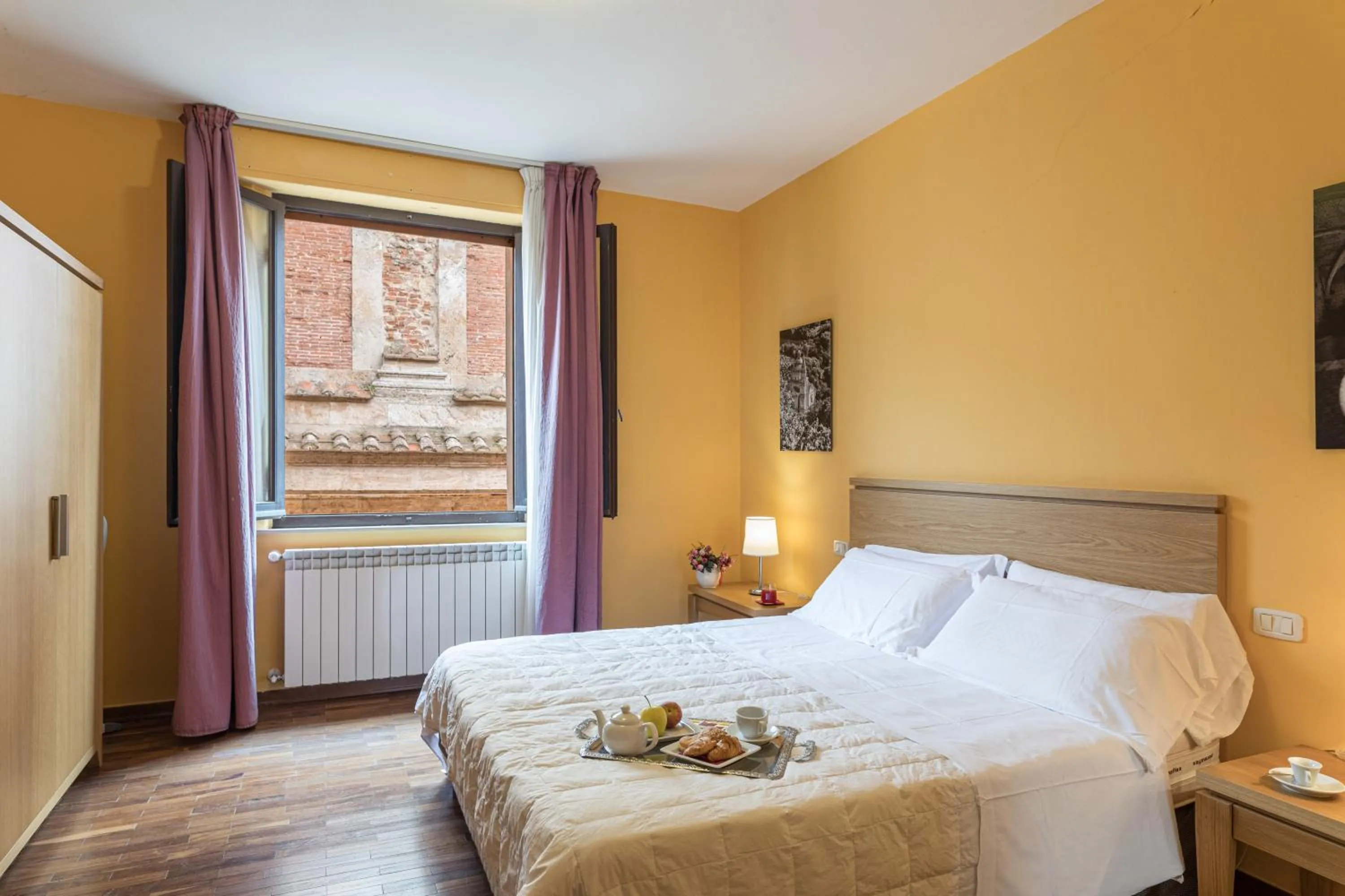 Bed in Bellarmino Boutique Apartments, Montepulciano