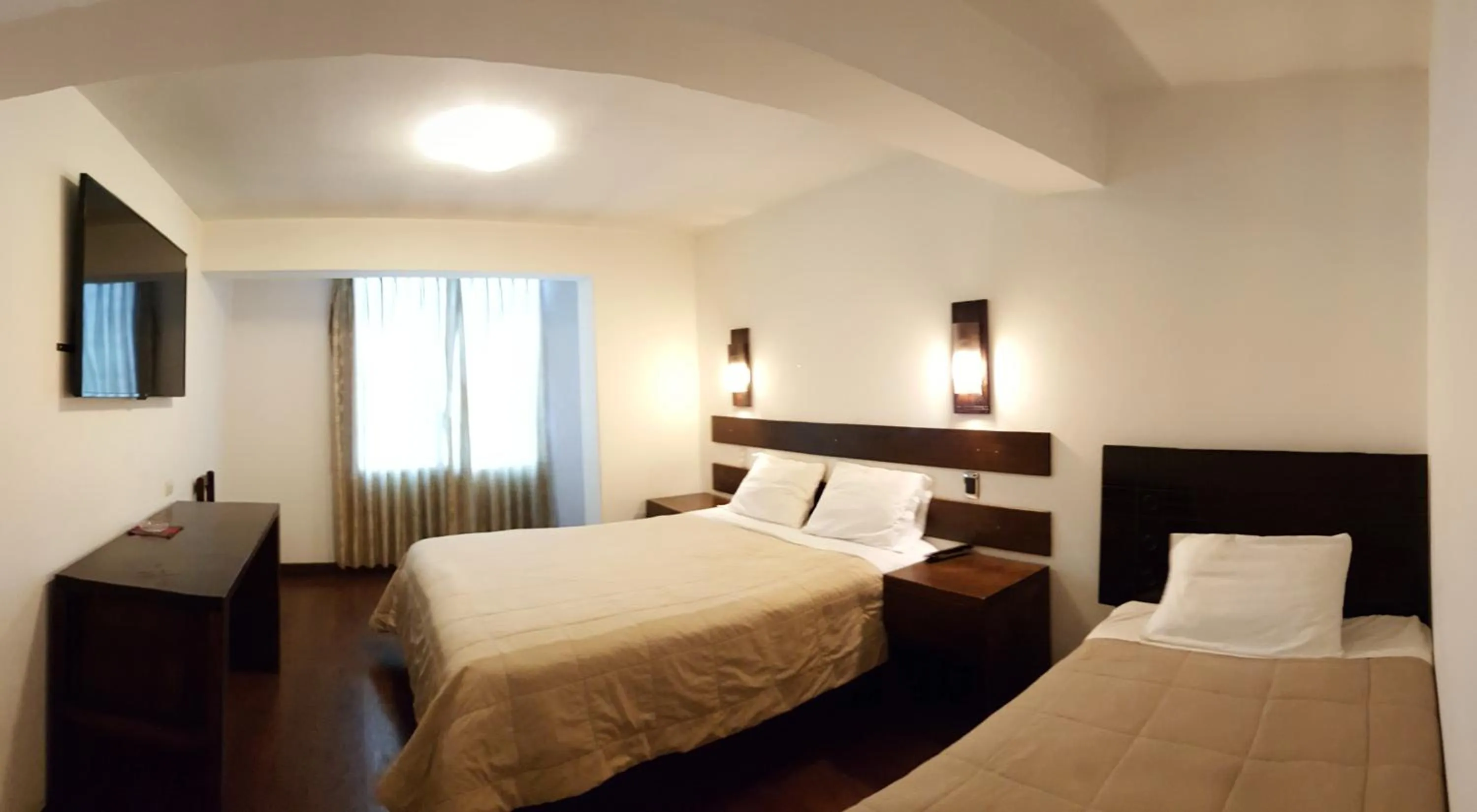 Bed in La Cabaña Hotel