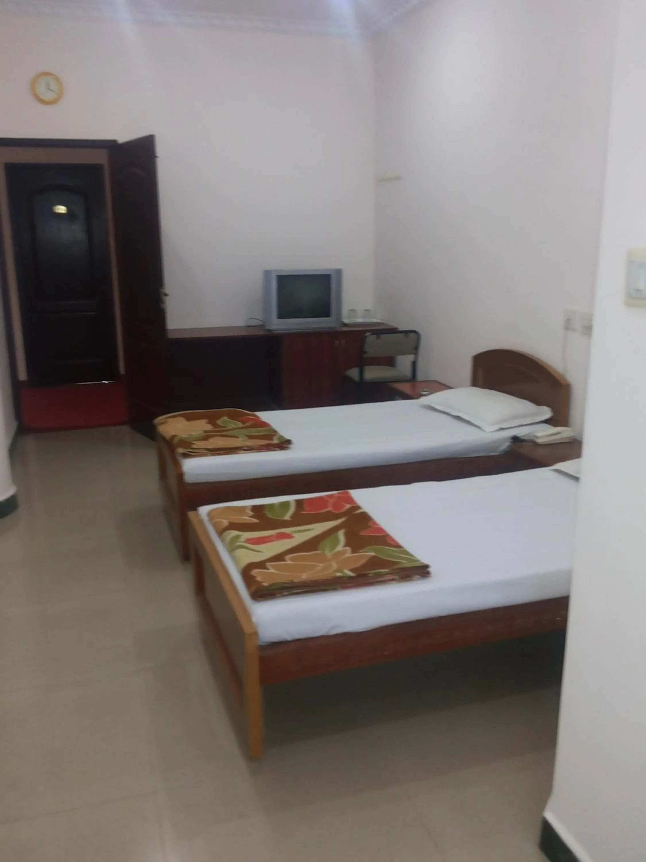 Bed in Hotel Nachiappa Palace