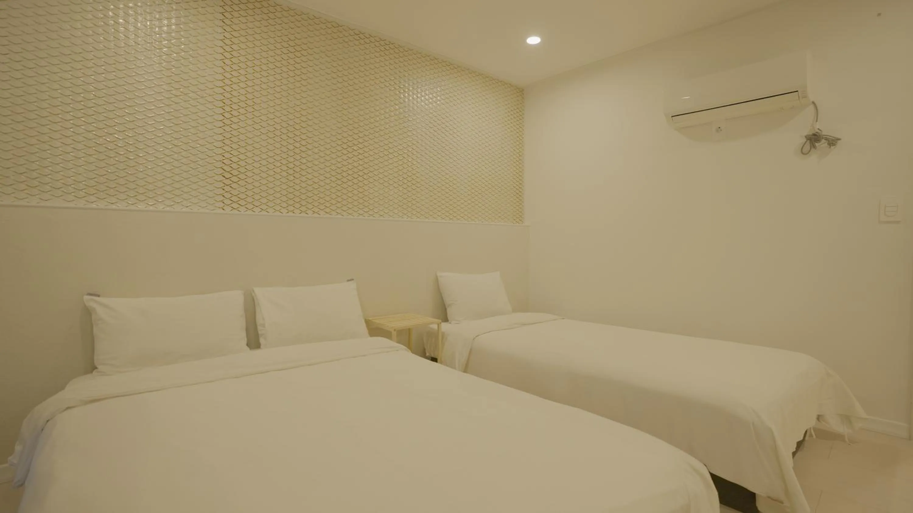 Bed in Jeju Stay Hotel