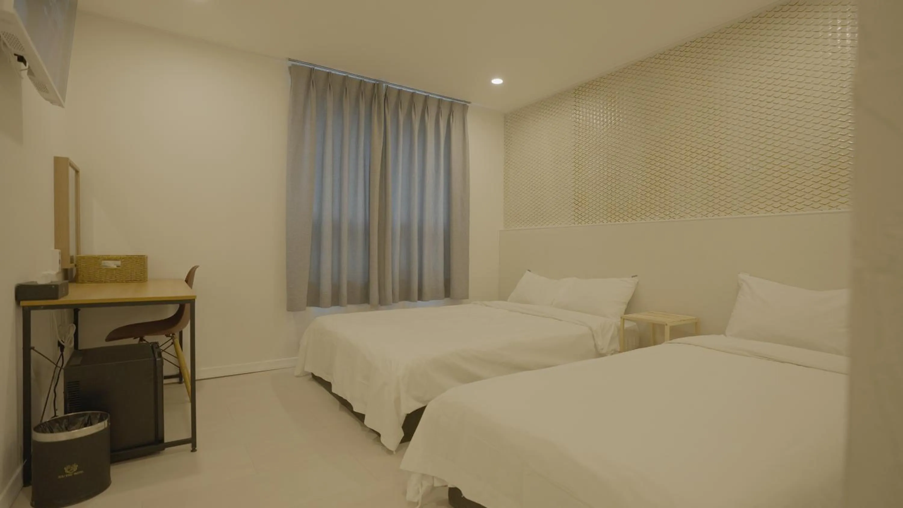 Bed in Jeju Stay Hotel