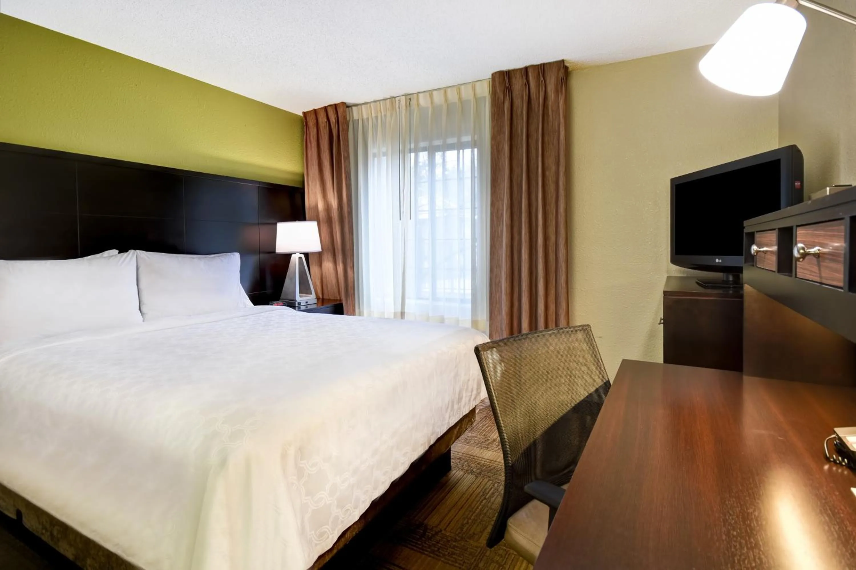 Photo of the whole room, Bed in Staybridge Suites Grand Rapids-Kentwood by IHG