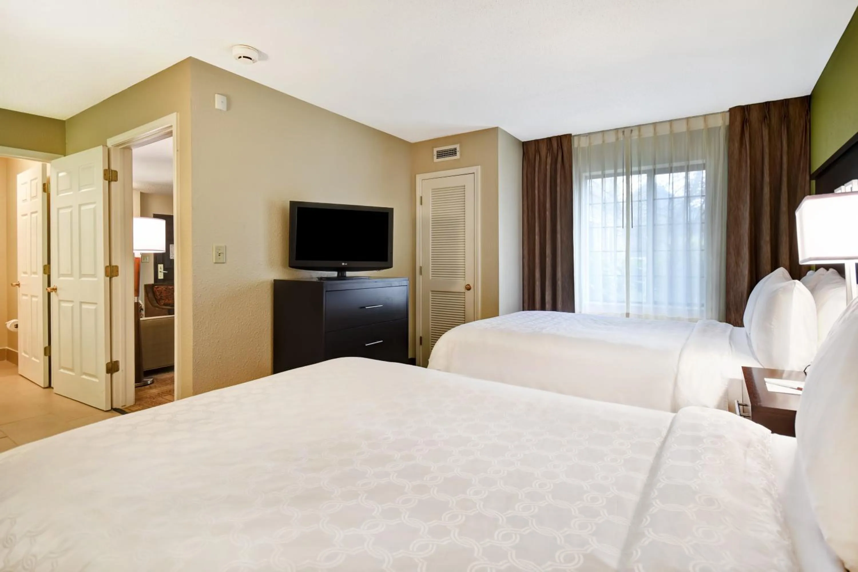 Photo of the whole room, Bed in Staybridge Suites Grand Rapids-Kentwood by IHG
