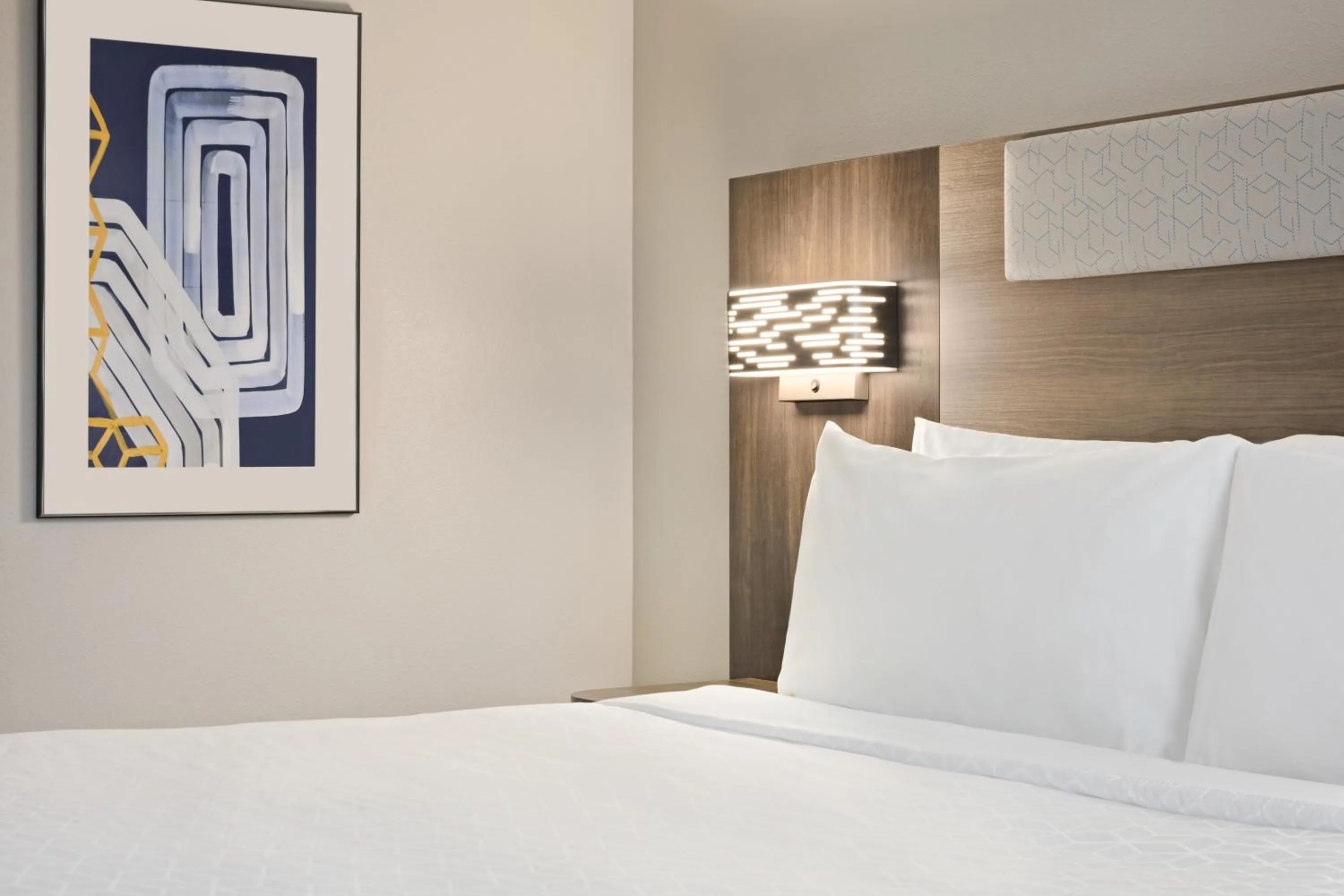 Bed in Holiday Inn Express & Suites Greenville-Downtown by IHG